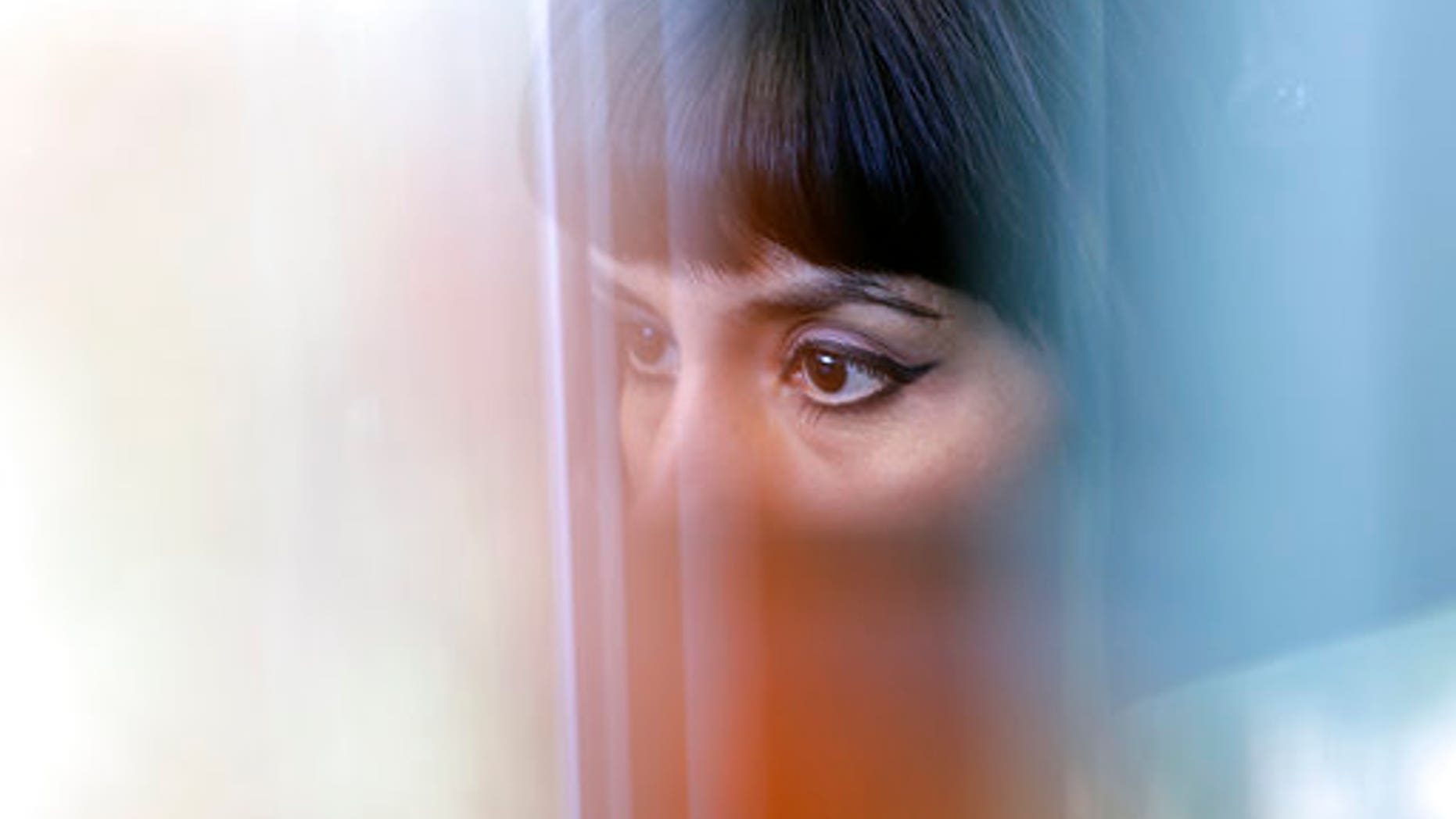 An advocate works in a cubicle at the National Domestic Violence Hotline center in Austin, Texas.