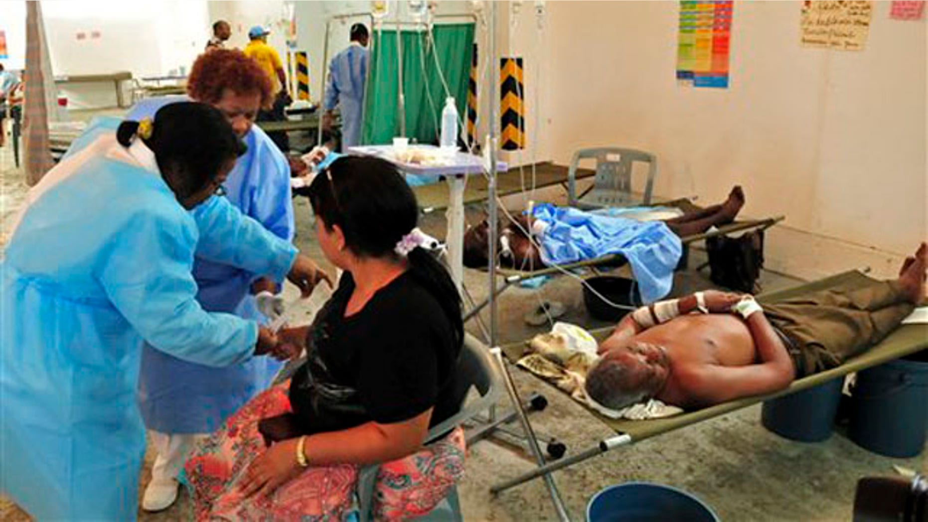 Patients suffering from cholera symptoms are treated at a hospital in Santo Domingo, Dominican Republic, Tuesday May 17, 2011. A wave of new cholera cases, with two deaths in recent days, has prompted the Dominican health authorities to declare a state of alert in 17 neighborhoods in the capital. The disease had not been detected in the country until after the outbreak in neighboring Haiti in October 2010 when fourteen people died and 750 were infected. (AP Photo/Manuel Diaz)