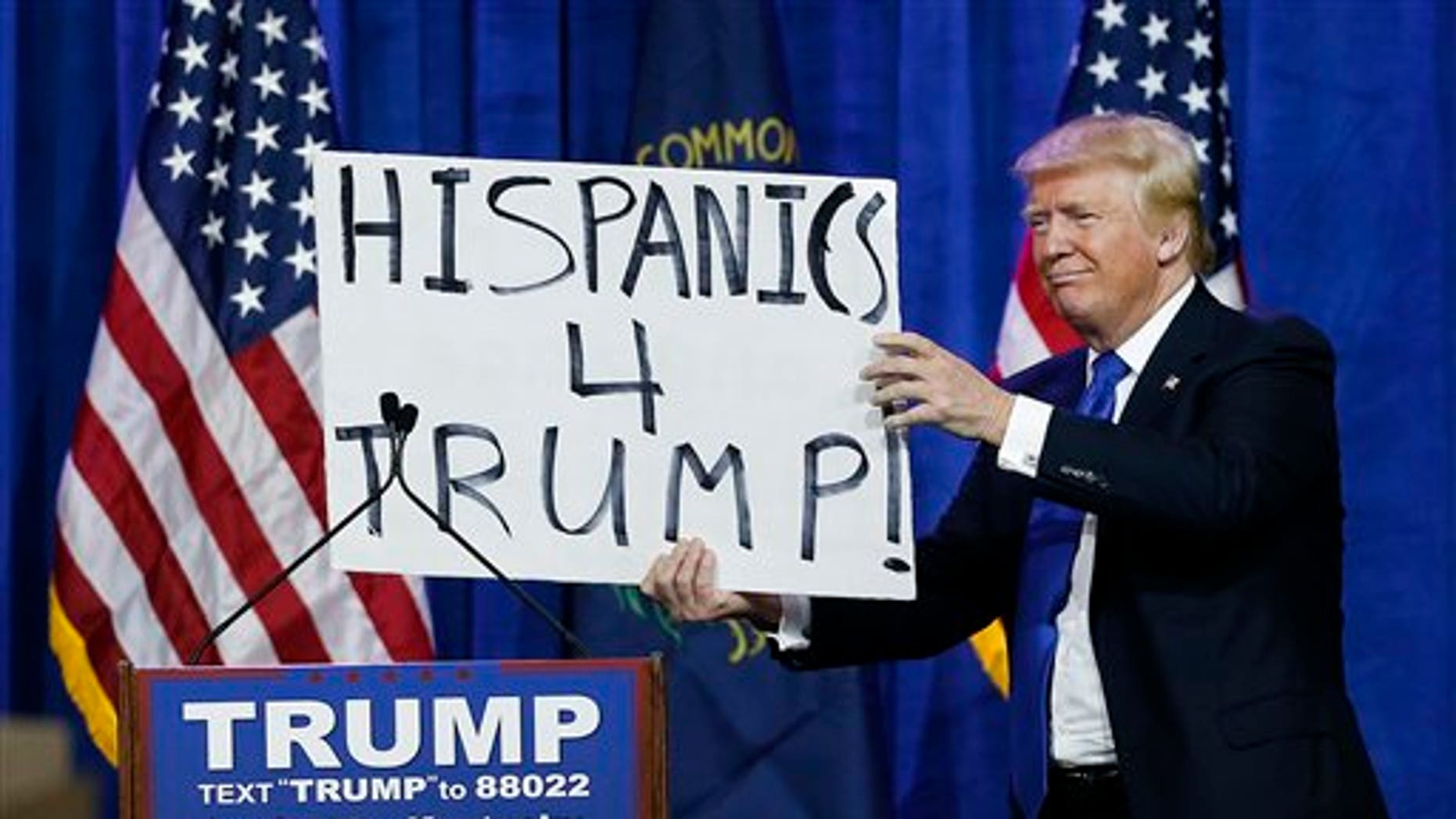 Donald Trump Responds To Hecklers With Hispanics 4 Trump Sign Fox News 0782