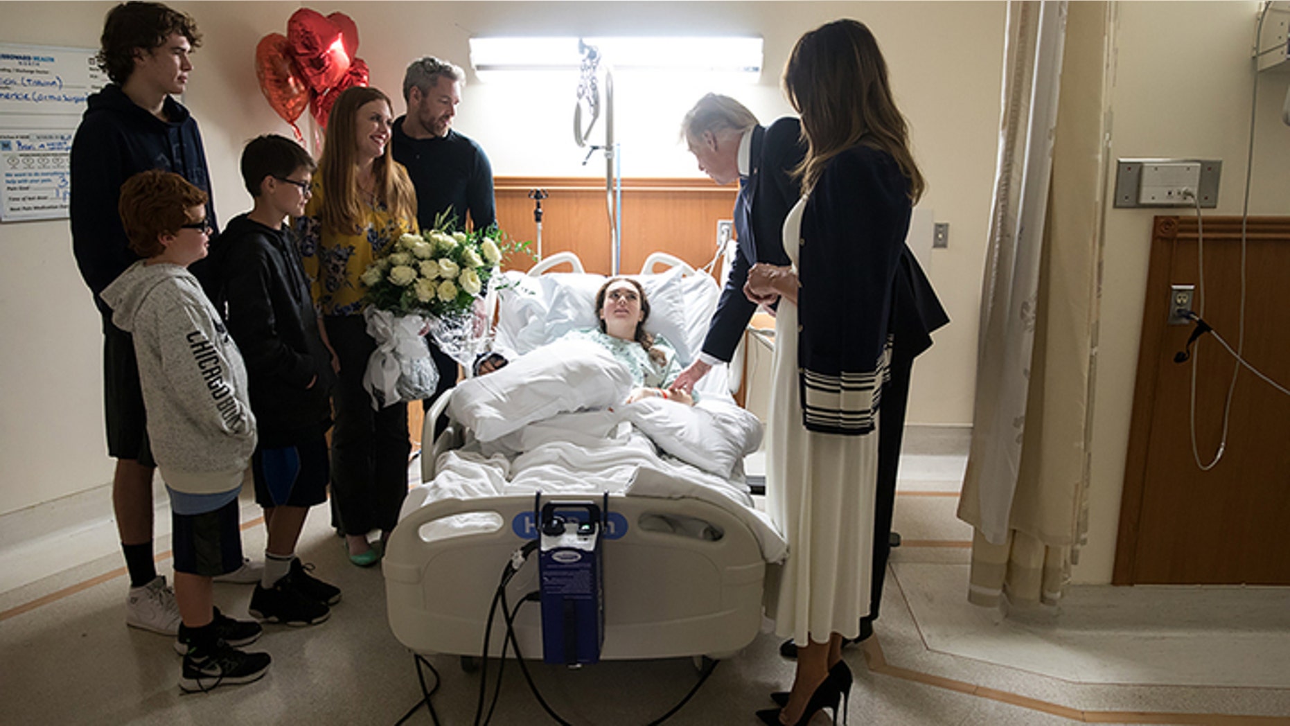 President Donald Trump and the first lady, Melania Trump, visiting Marjory Stoneman Douglas High student Maddy Wilford and her family at the hospital two days after the deadly Florida shooting.