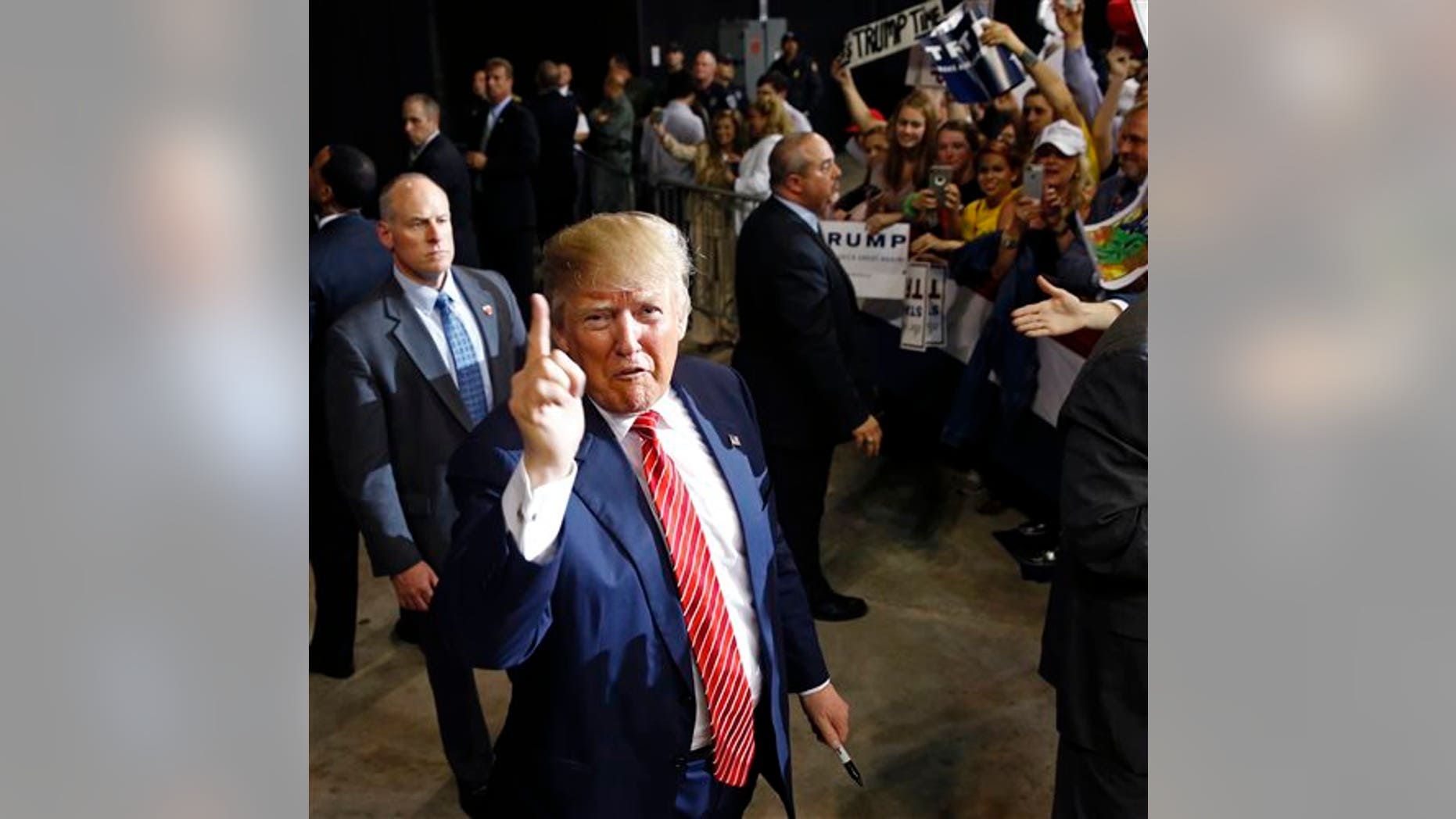 Republican presidential candidate Donald Trump thanks photographers as he greets the crowd after speaking at a campaign rally in Baton Rouge, La., Thursday, Feb. 11, 2016. (AP Photo/Gerald Herbert)