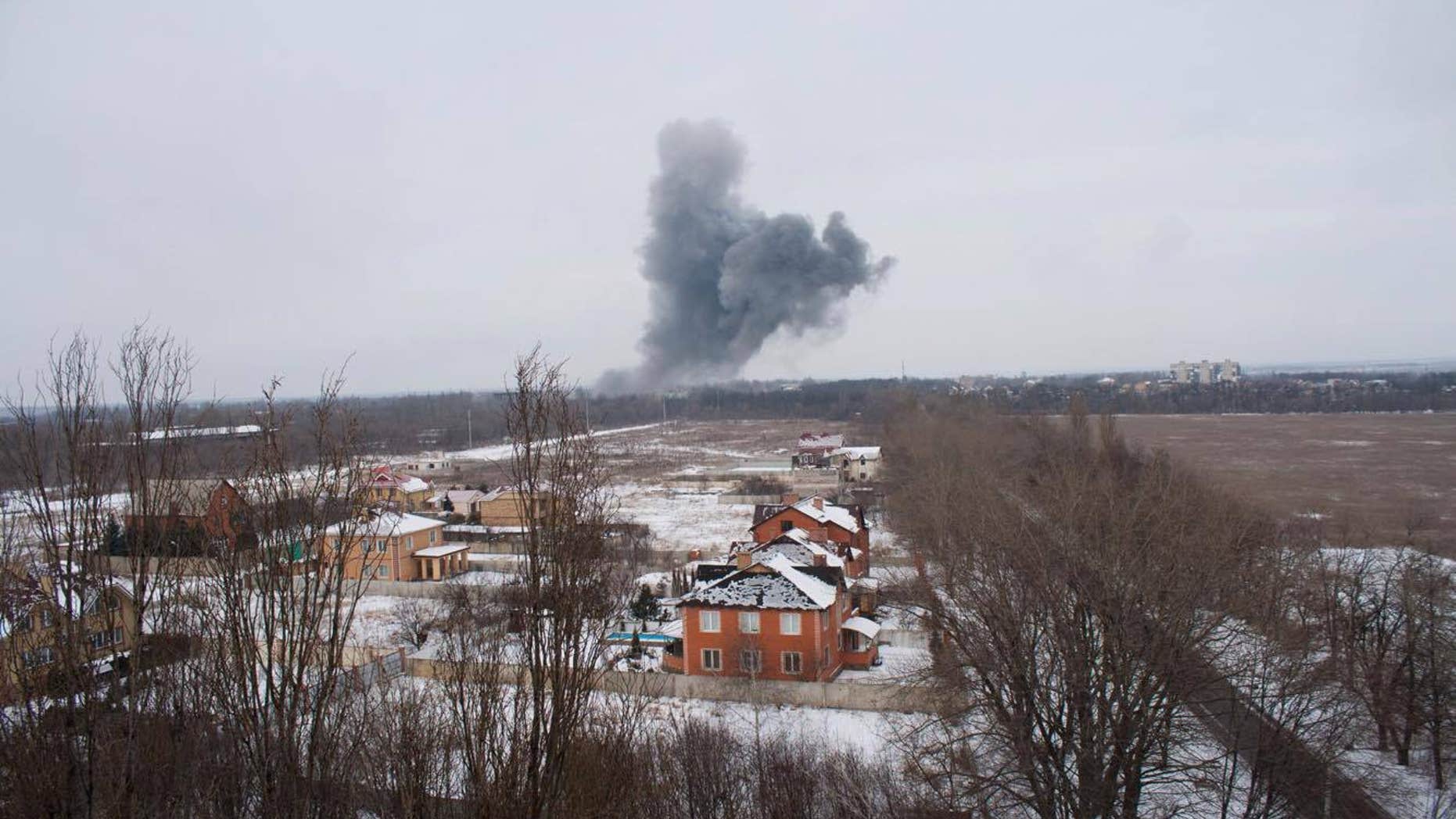 Artillery shells hit industrial areas in Donetsk as the conflict enters its third year.