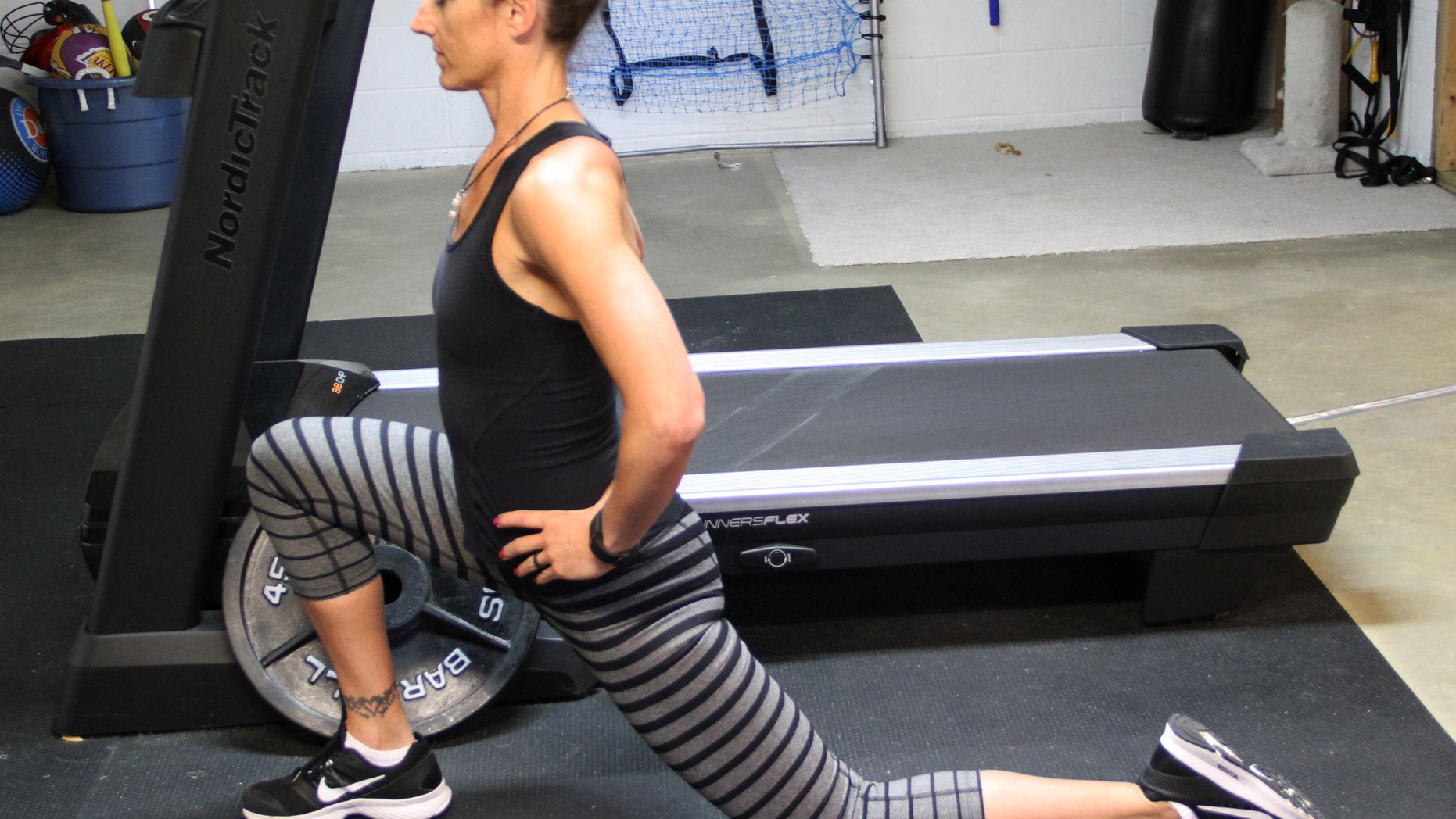 Jennifer Ernst stretches her hip flexors before exercising. Though she runs consistently, experts diagnosed her with Dormant Butt Syndrome, a condition in which weak glute muscles put strain on her knees, which damaged her meniscus.