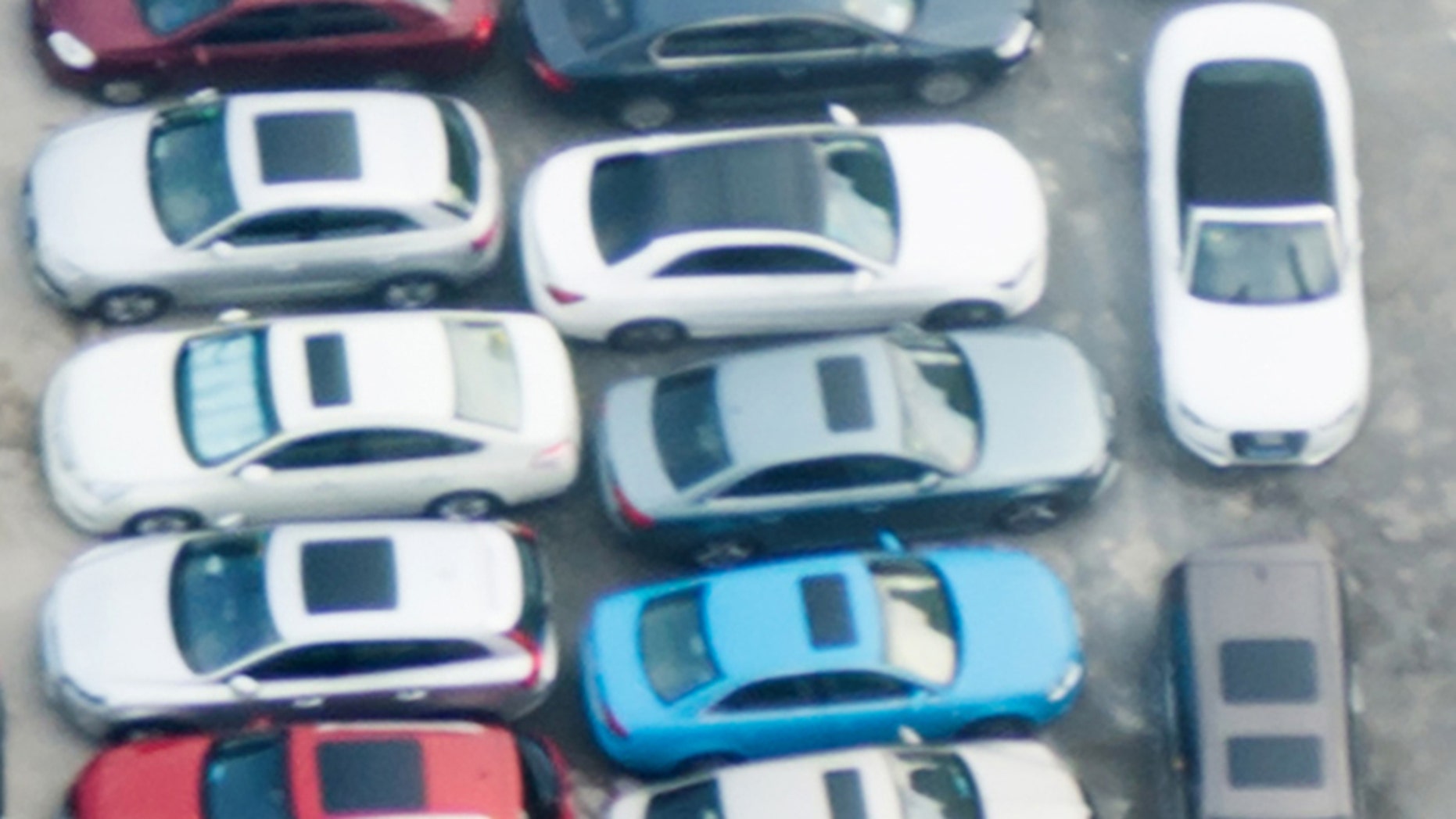 Directly above view of crowded parking lot.