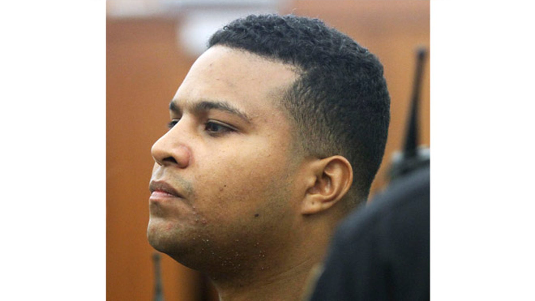 April 13, 2013: Daniel Rodriguez stands during his arraignment in Kent County District Court in Warwick, R.I., for the killing of Vanessa Perez and her mother Evelyn Burgos in Johnston, R.I., on Sunday.