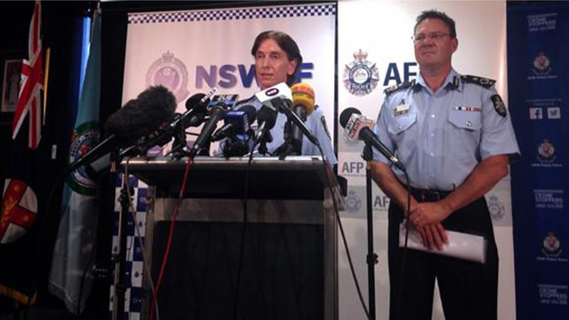 Feb. 11, 2015: Australian Federal Police Deputy Commissioner Michael Phelan, right, listens as New South Wales Deputy Police Commissioner Catherine Burn speaks during a media conference in Sydney. (Reuters/Lincoln Feast)