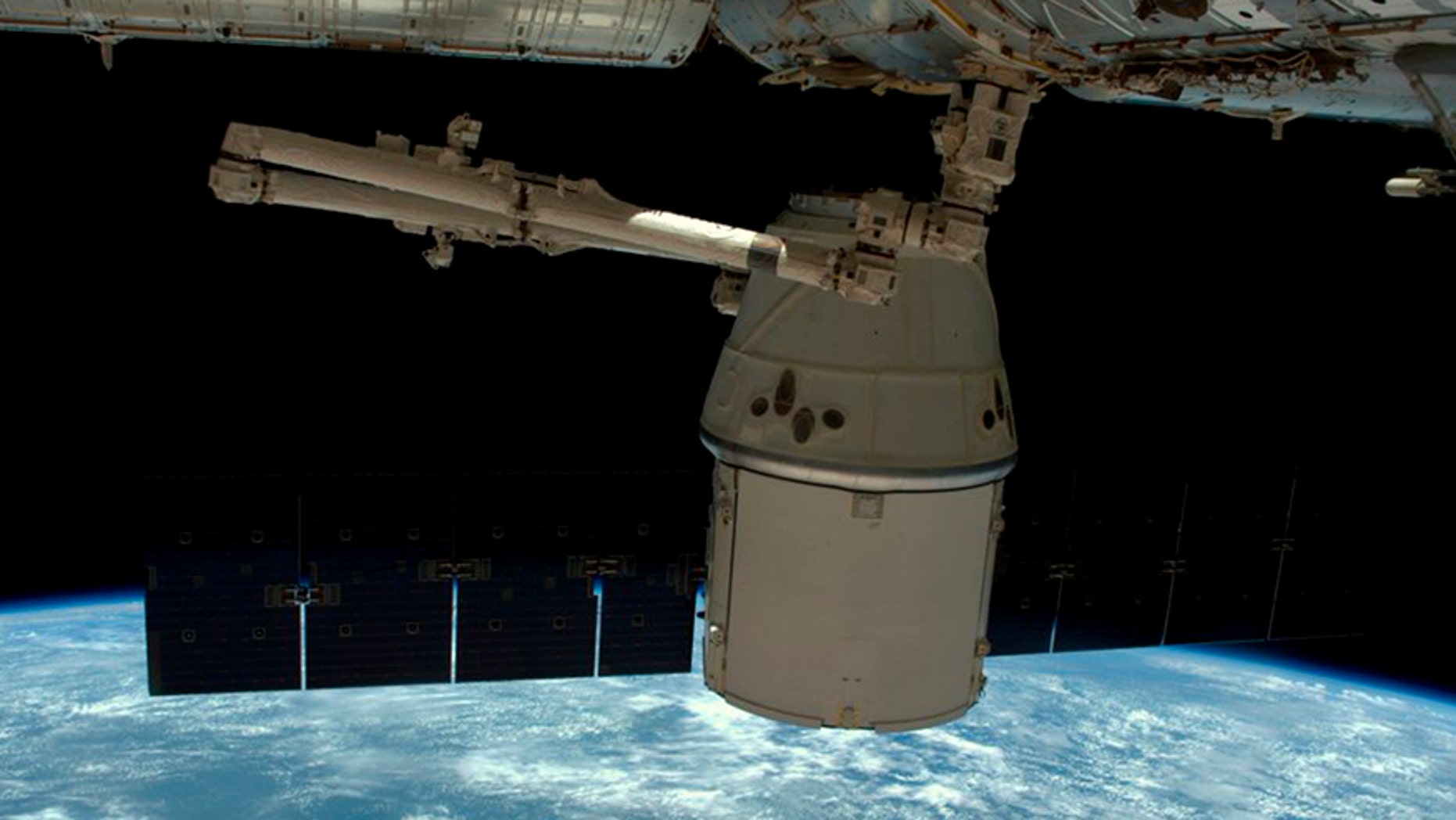 A NASA photo shows a SpaceX Dragon capsule as it is released from the International Space Station in this image released to social media on May 11, 2016. (NASA)