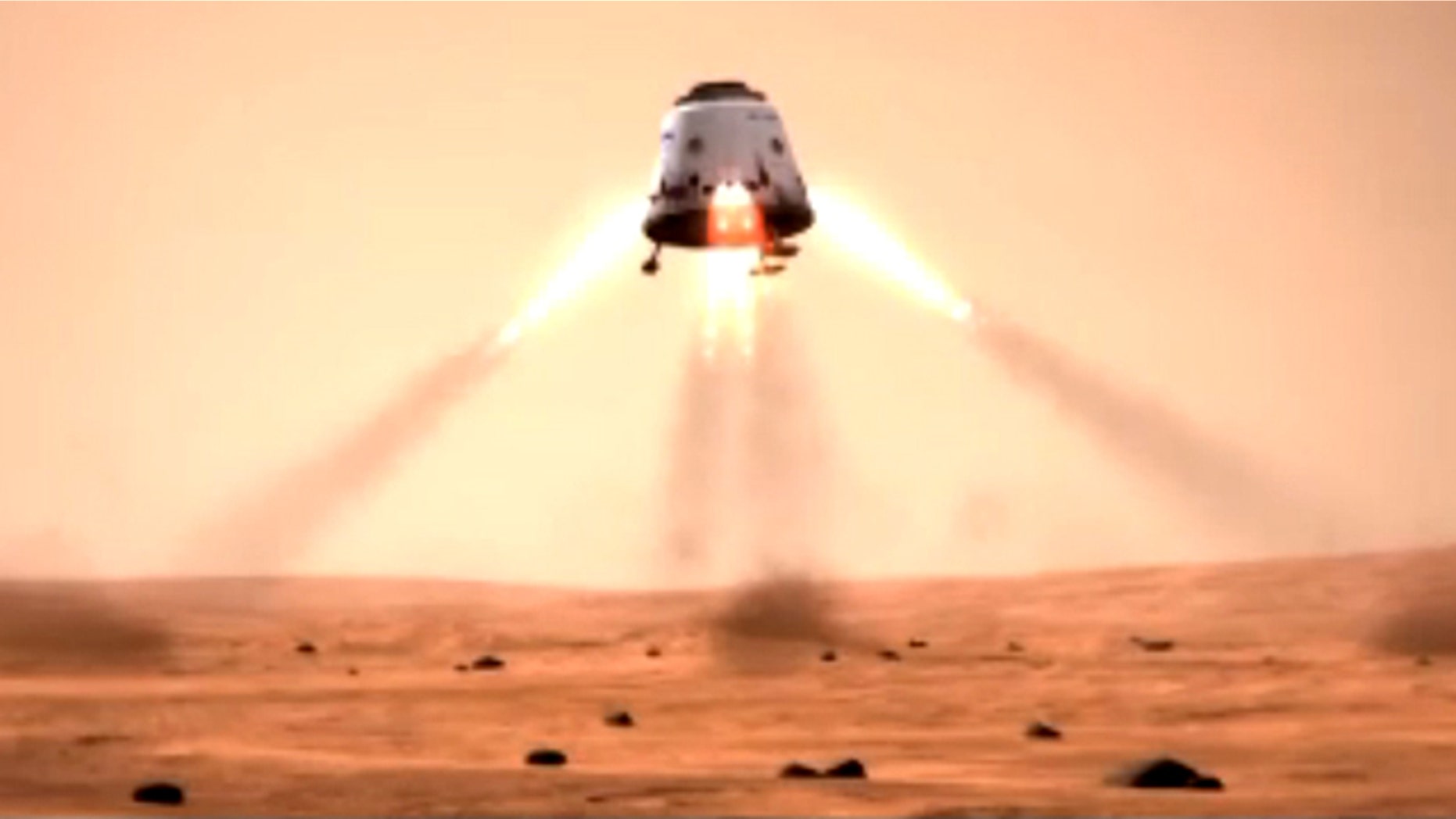 This still from a SpaceX mission concept video shows a Dragon space capsule landing on the surface of Mars. SpaceX's Dragon is a privately built space capsule to carry unmanned payloads, and eventually astronauts, into space.