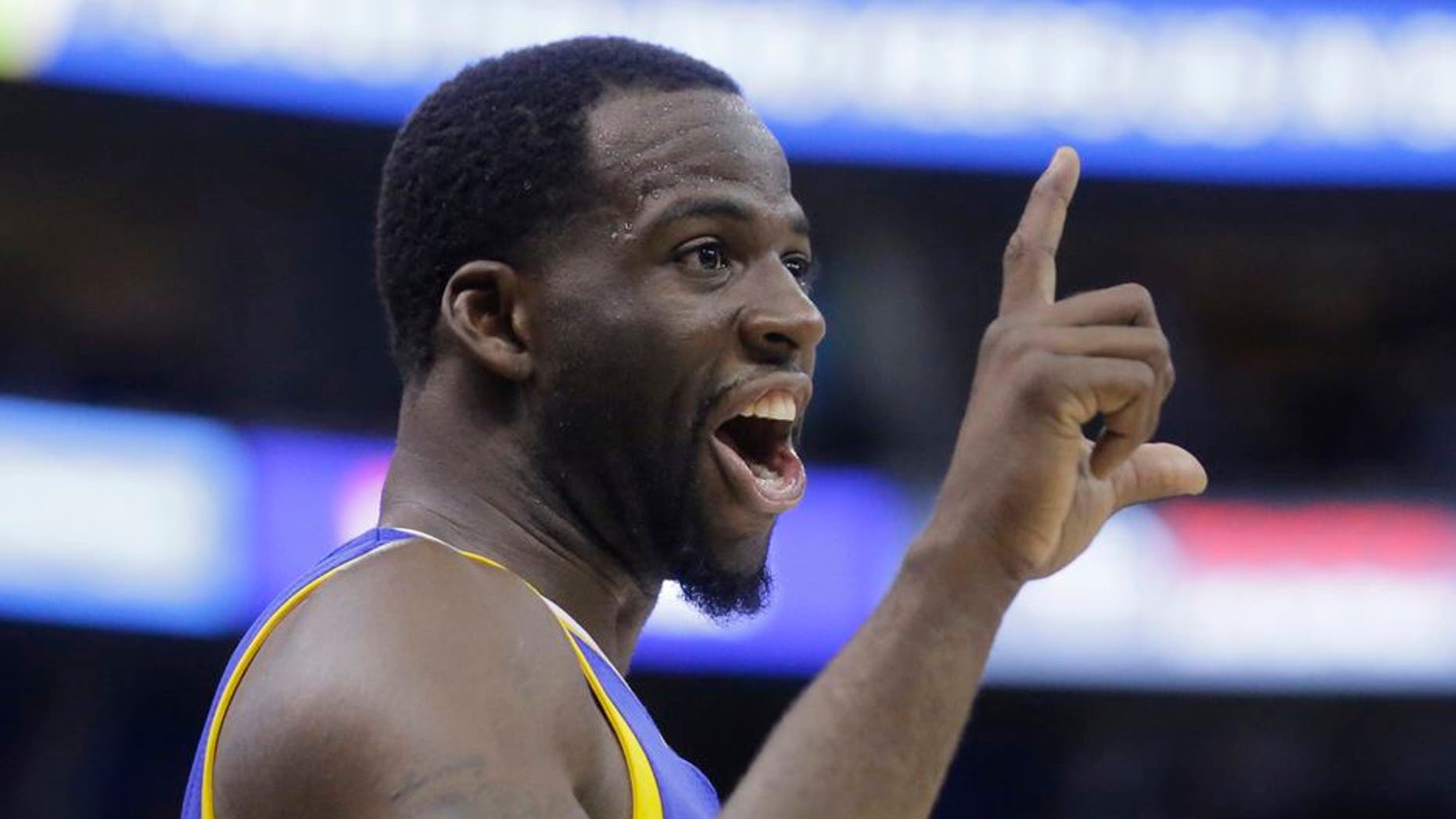 Golden State Warriors forward Draymond Green reacts to the Utah Jazz fans in the second half during Game 3 of the NBA basketball second-round playoff series Saturday, May 6, 2017, in Salt Lake City. Warriors won 102 - 91. (AP Photo/Rick Bowmer)
