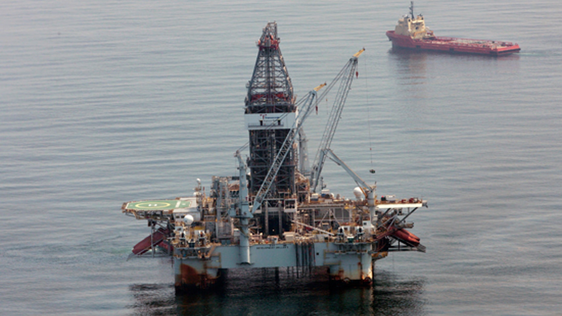 In a Tuesday, June 8, 2010 photo, a deepwater drilling rig operates near the site of the Deepwater Horizon disaster in the Gulf of Mexico. (AP)