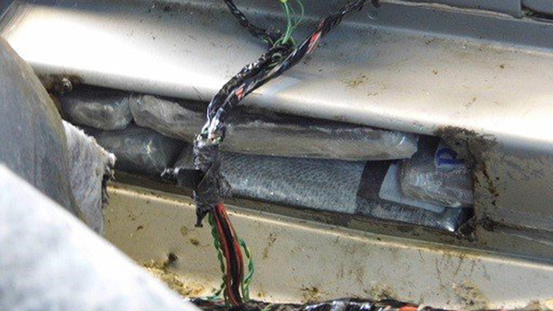 A U.S. Customs and Border Protection detector dog alerted officers to the driver-side rocker panel of the 2011 Chrysler 200 that the elderly American citizen was driving, officials say.