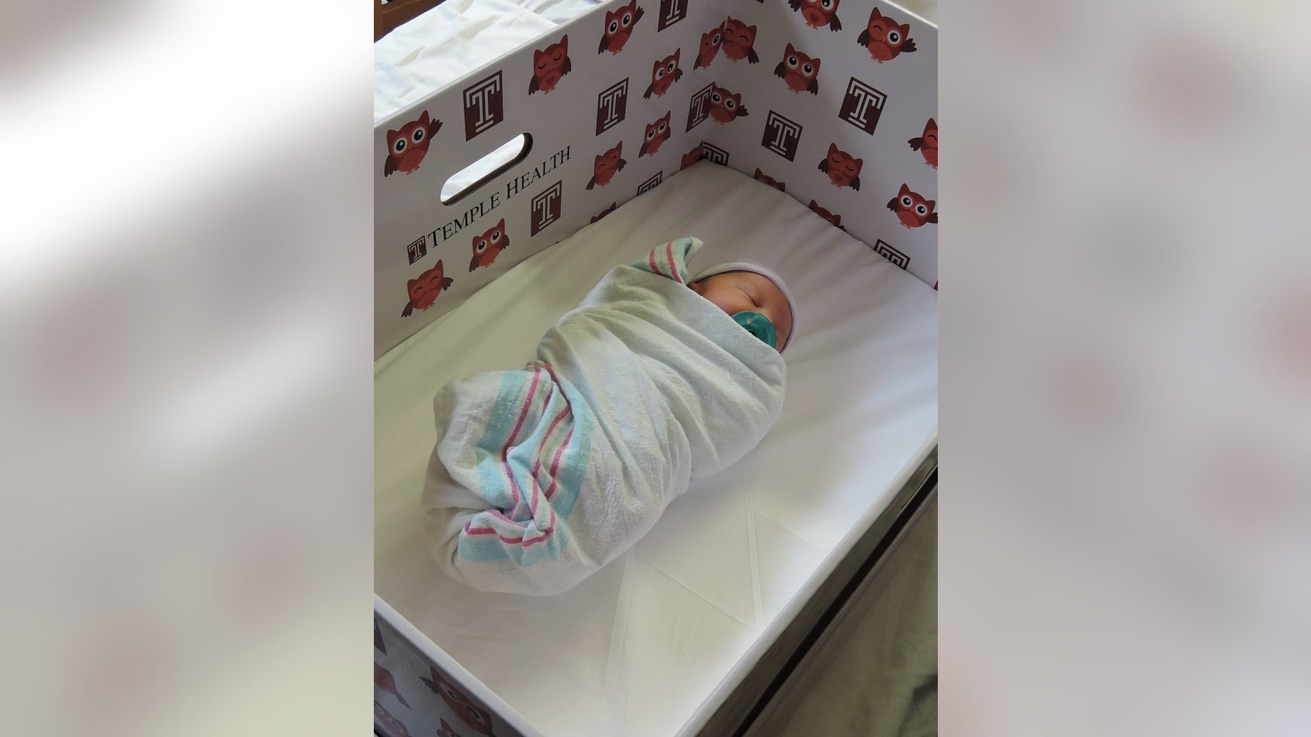A newborn in a Temple University Hospital baby box, which serves as a bassinet. (image courtesy Temple University Hospital)