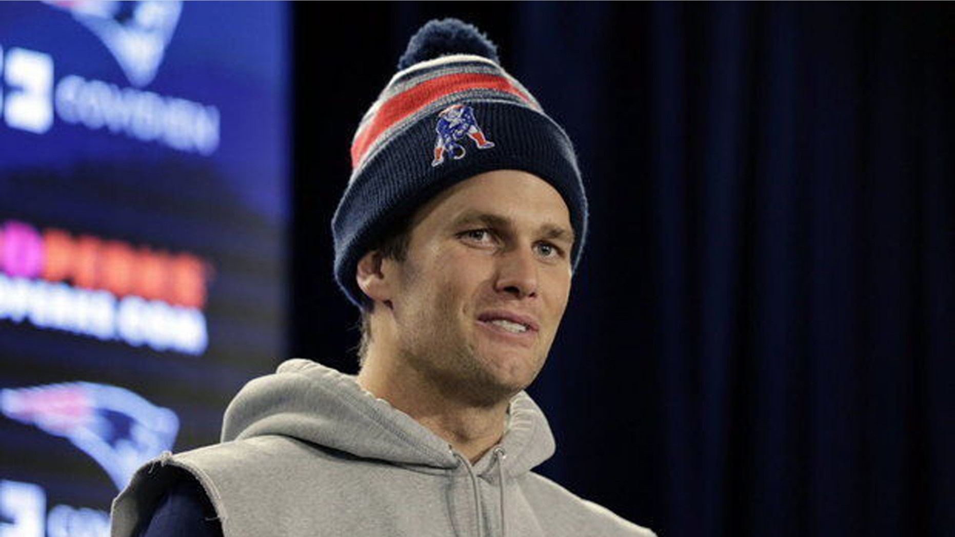 In this undated photo, Tom Brady takes questions from the media at Gillette Stadium in Foxboro, Mass.