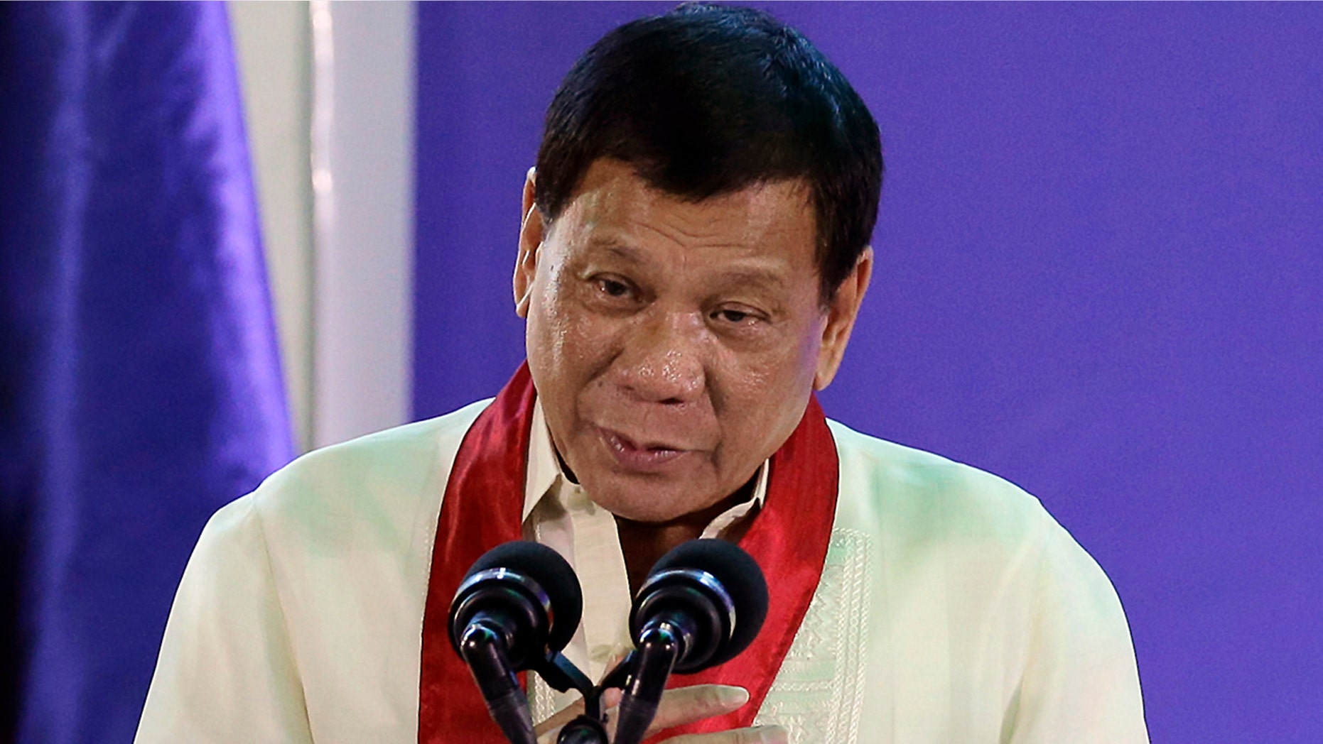 FILE - In this Aug. 2, 2017 file photo, Philippine President Rodrigo Duterte speaks during the 113th Founding Anniversary of the Bureau of Internal Revenue in metropolitan Manila. The Philippine president says he became a local millionaire at a young age due to inheritance and reiterated he has no unexplained wealth as alleged by his leading critic, who questioned his claim that he was born into an impoverished family. (AP Photo/Aaron Favila, File)
