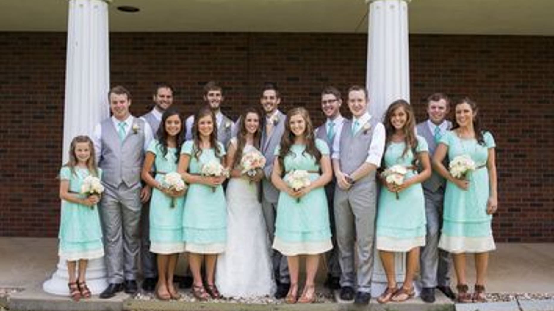 June 21, 2014. Jill Dillard, formerly Duggar, and Derick Dillard, both center, stand with their entire bridal party consisting of (LtoR) Johannah Duggar, Joseph Duggar, Madison McCalmon, Jinger Duggar, Jana Duggar, Daniel Dillard, Joy-Anna Duggar, Tony Dillard, Stephen Jones, Jessa Duggar, John-David Duggar, Anna Duggar prior to their wedding in Springdale, Arkansas