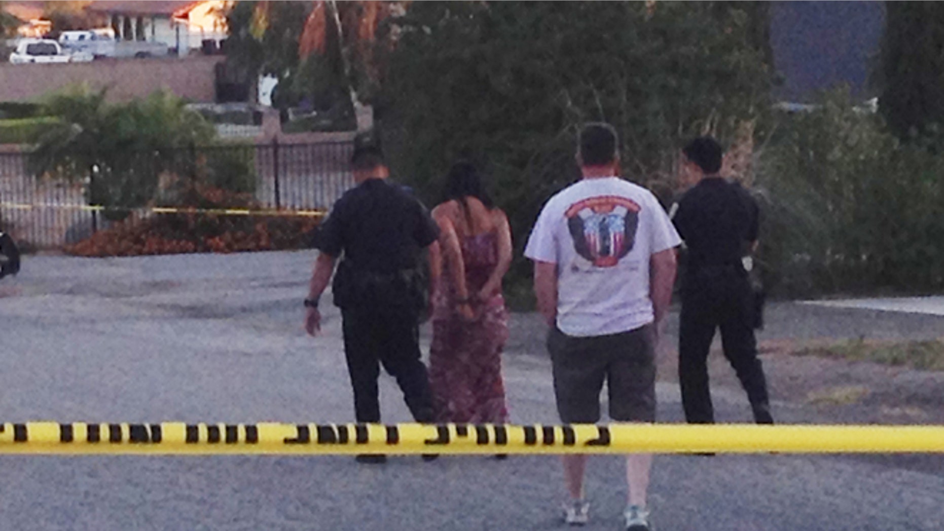 June 13, 2014: Authorities lead Soukvilay Barton away in handcuffs after she was arrested on suspicion of driving under the influence in Riverside, Calif.