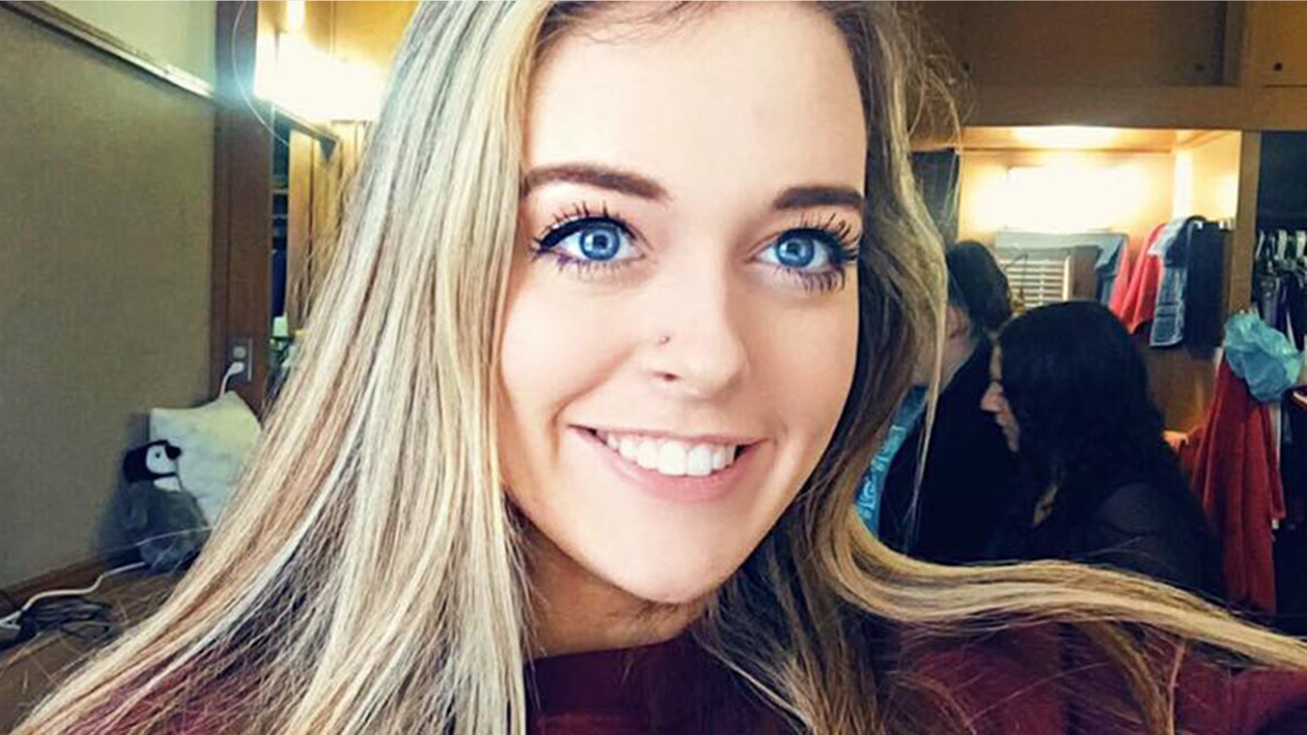 The 19-year-old college coed was pulled aside by TSA after flashing her college's salute at a traveler wearing a Texas Tech hoodie.