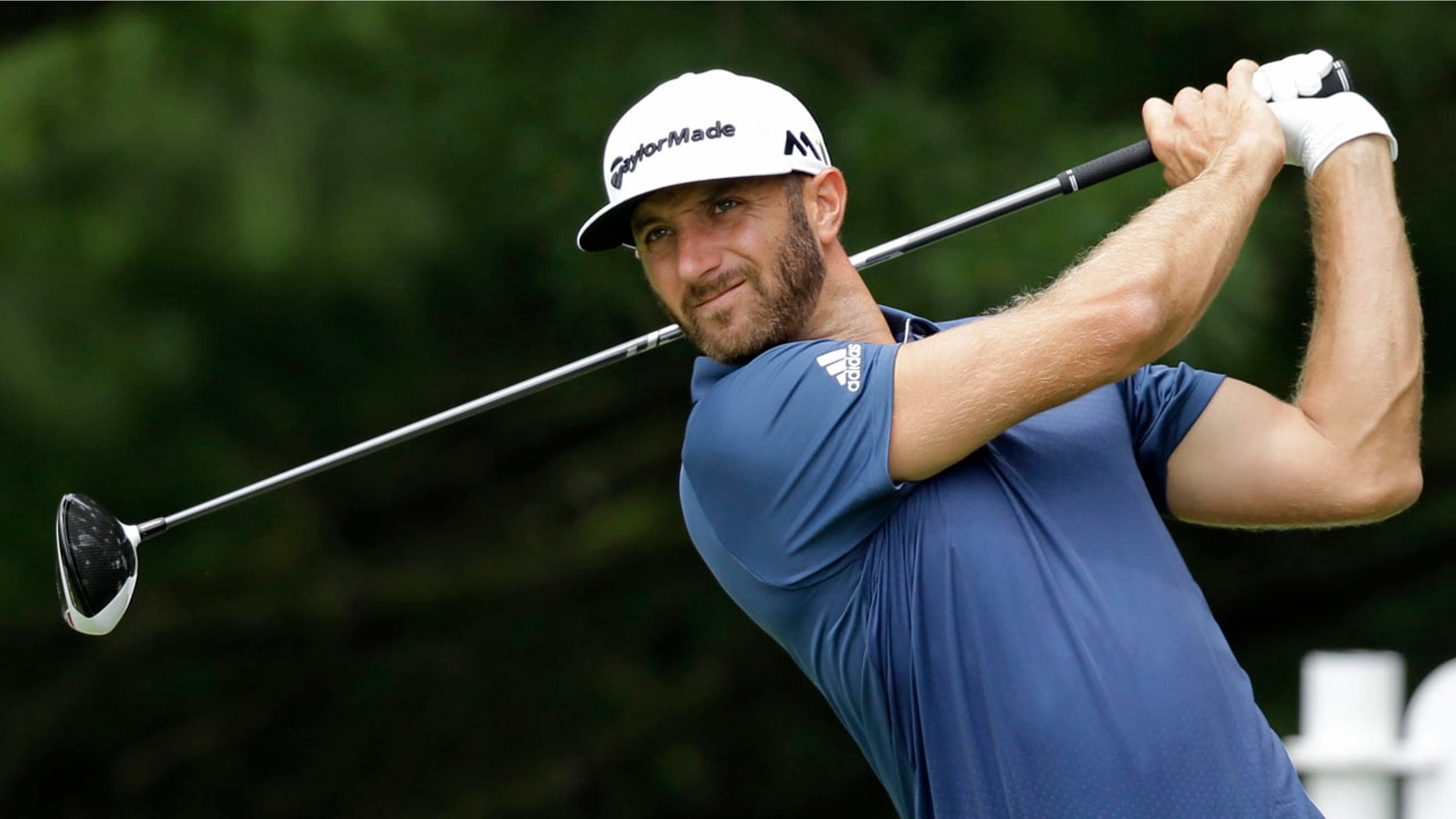July 3, 2016: Dustin Johnson tees off on the second hole during the final round of the Bridgestone Invitational golf tournament at Firestone Country Club in Akron, Ohio.