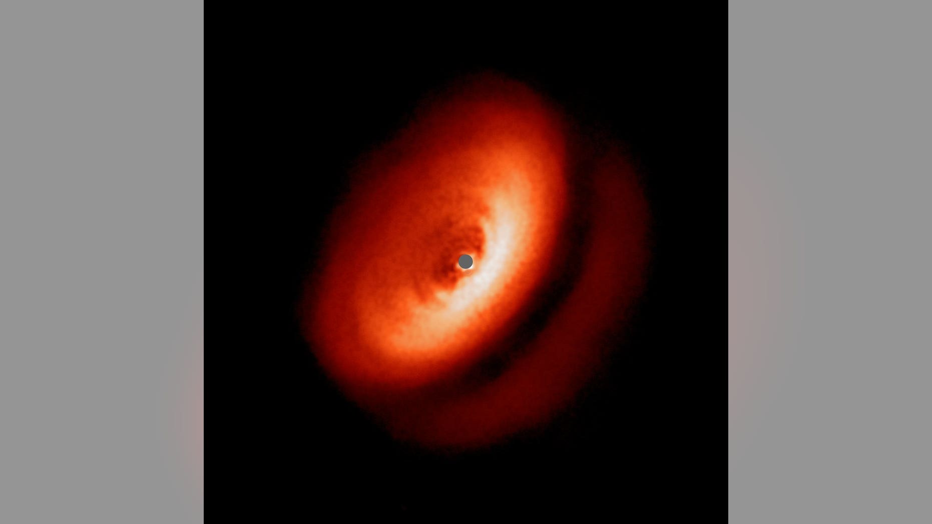 An image from the Very Large Telescope's SPHERE instrument showing the dusty disk around the young star IM Lupi.