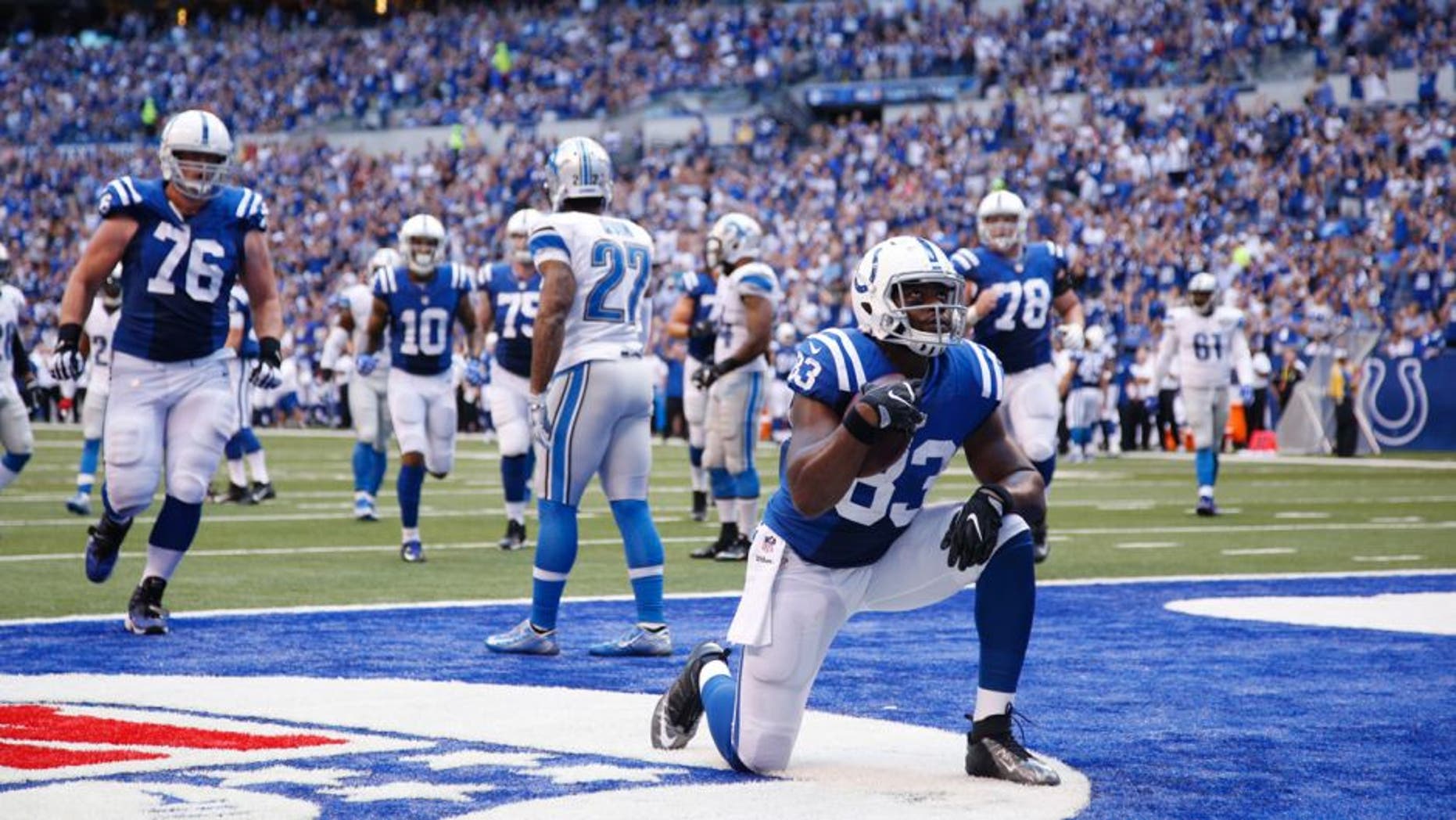 INDIANAPOLIS, IN - SEPTEMBER 11: Dwayne Allen #83 of the Indianapolis Colts reacts after a 19-yard touchdown reception against the Detroit Lions during the game at Lucas Oil Stadium on September 11, 2016 in Indianapolis, Indiana. The Lions defeated the Colts 39-35. (Photo by Joe Robbins/Getty Images)