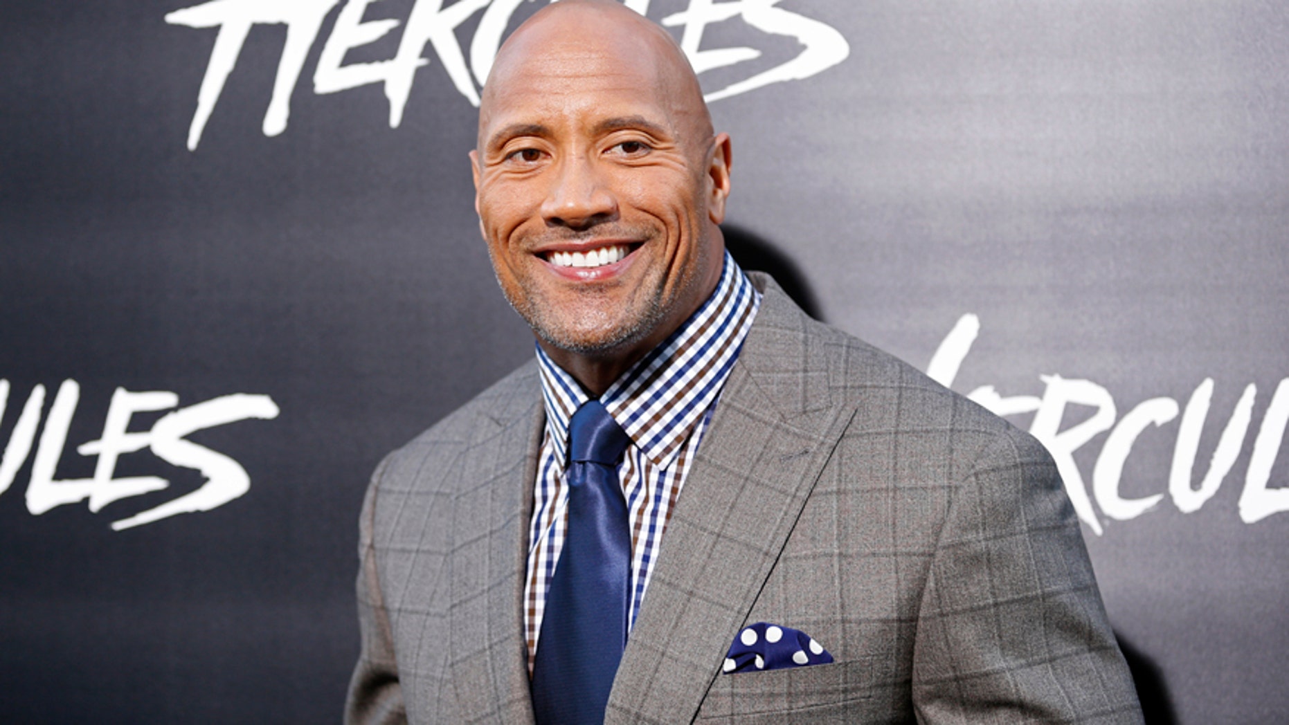 Cast member Dwayne Johnson poses at the Los Angeles premiere of "Hercules" in Hollywood, California July 23, 2014.