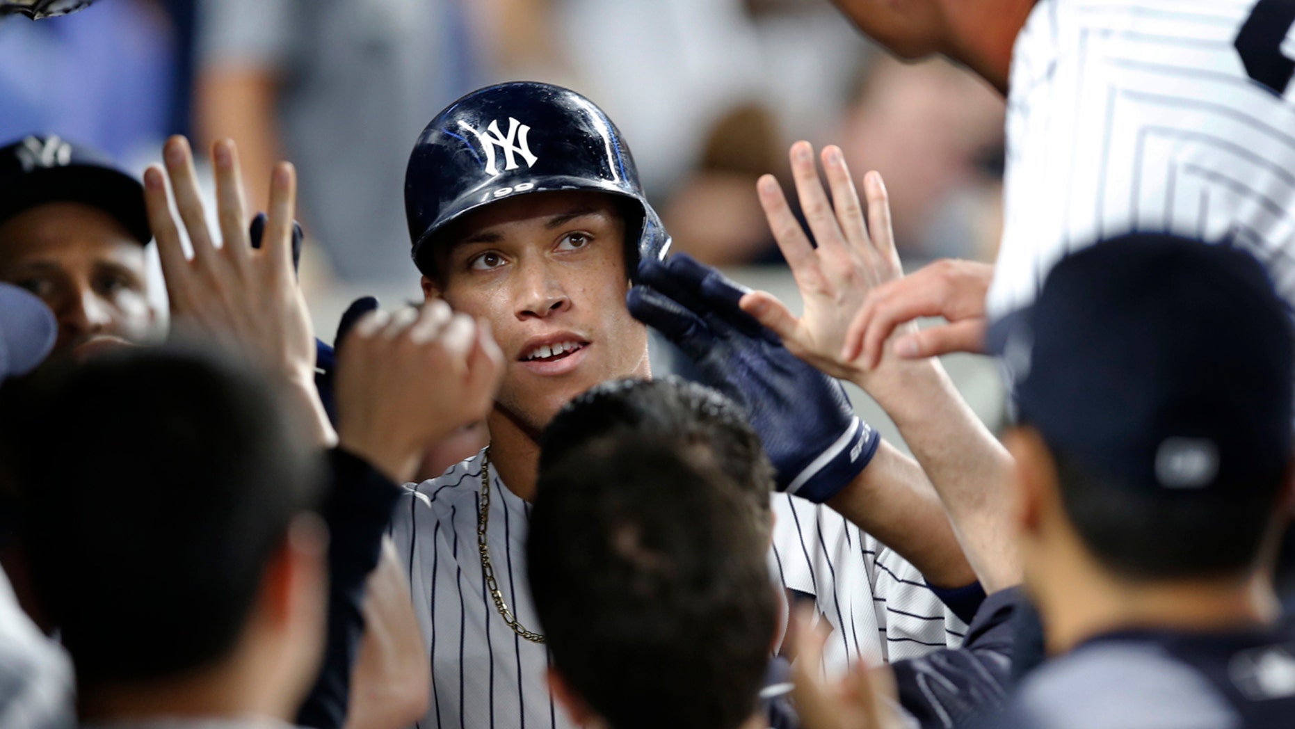 July 7: New York Yankees' Aaron Judge, center, is congratulated after his fifth-inning home run against the Milwaukee Brewers in a baseball game in in New York.
