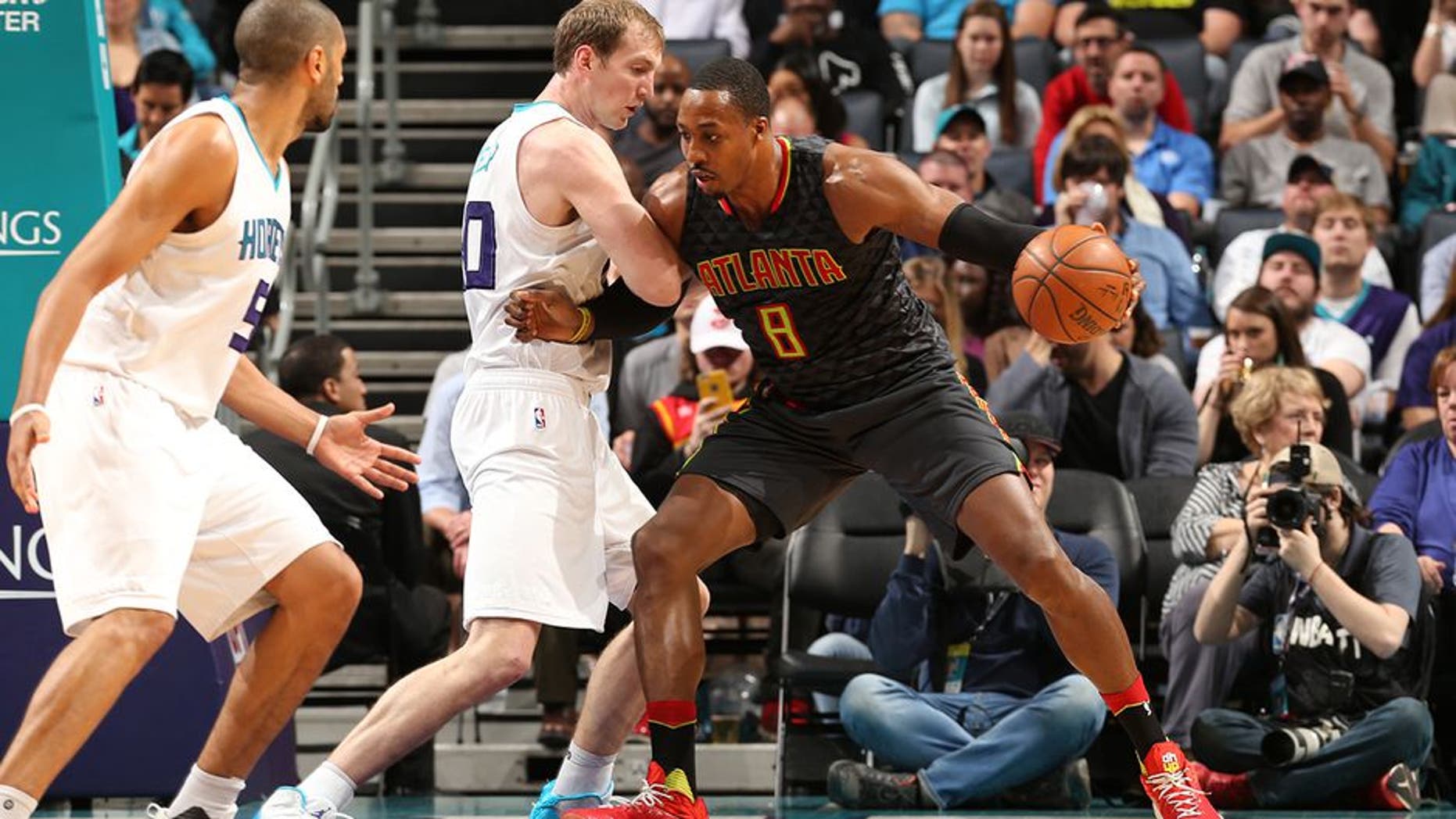 CHARLOTTE, NC - MARCH 20: Dwight Howard #8 of the Atlanta Hawks handles the ball during a game against the Charlotte Hornets on March 20, 2017 at Spectrum Center in Charlotte, North Carolina. NOTE TO USER: User expressly acknowledges and agrees that, by downloading and/or using this photograph, user is consenting to the terms and conditions of the Getty Images License Agreement. Mandatory Copyright Notice: Copyright 2017 NBAE (Photo by Kent Smith/NBAE via Getty Images)