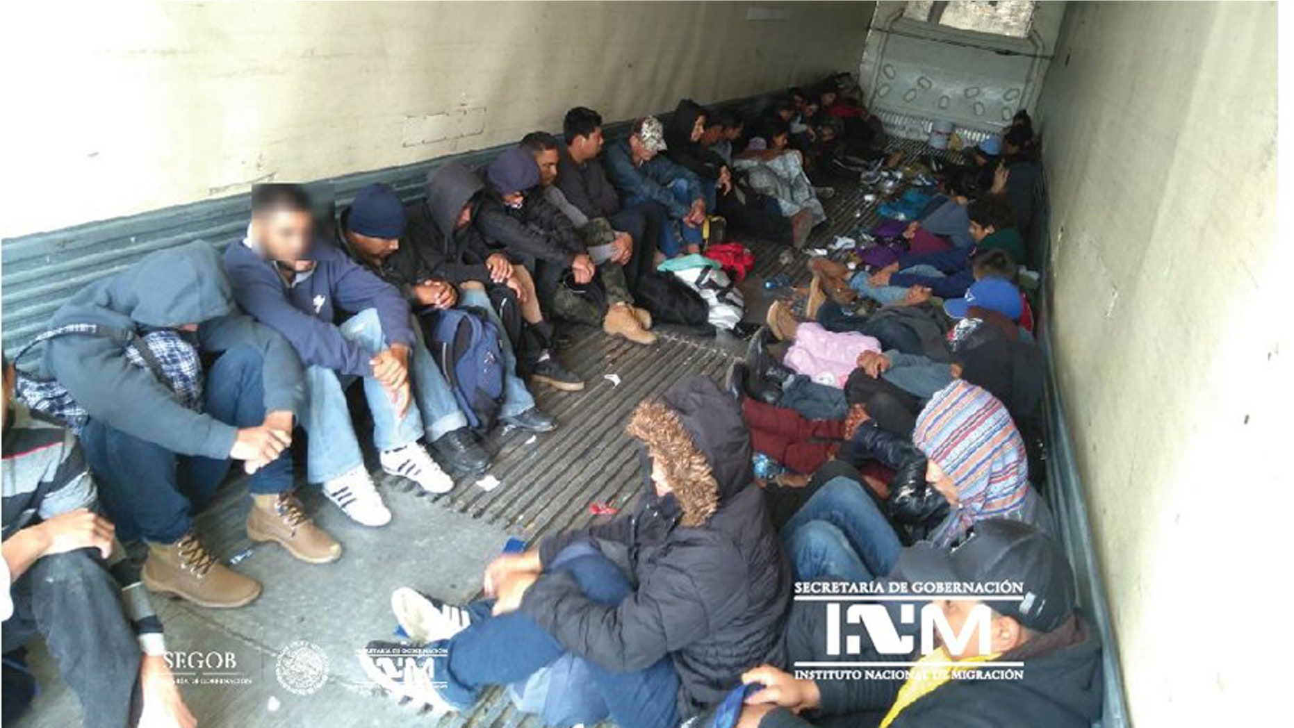 Mexican officials say they found 103 Central American migrants in a freight trailer abandoned near the U.S.-Mexico border.