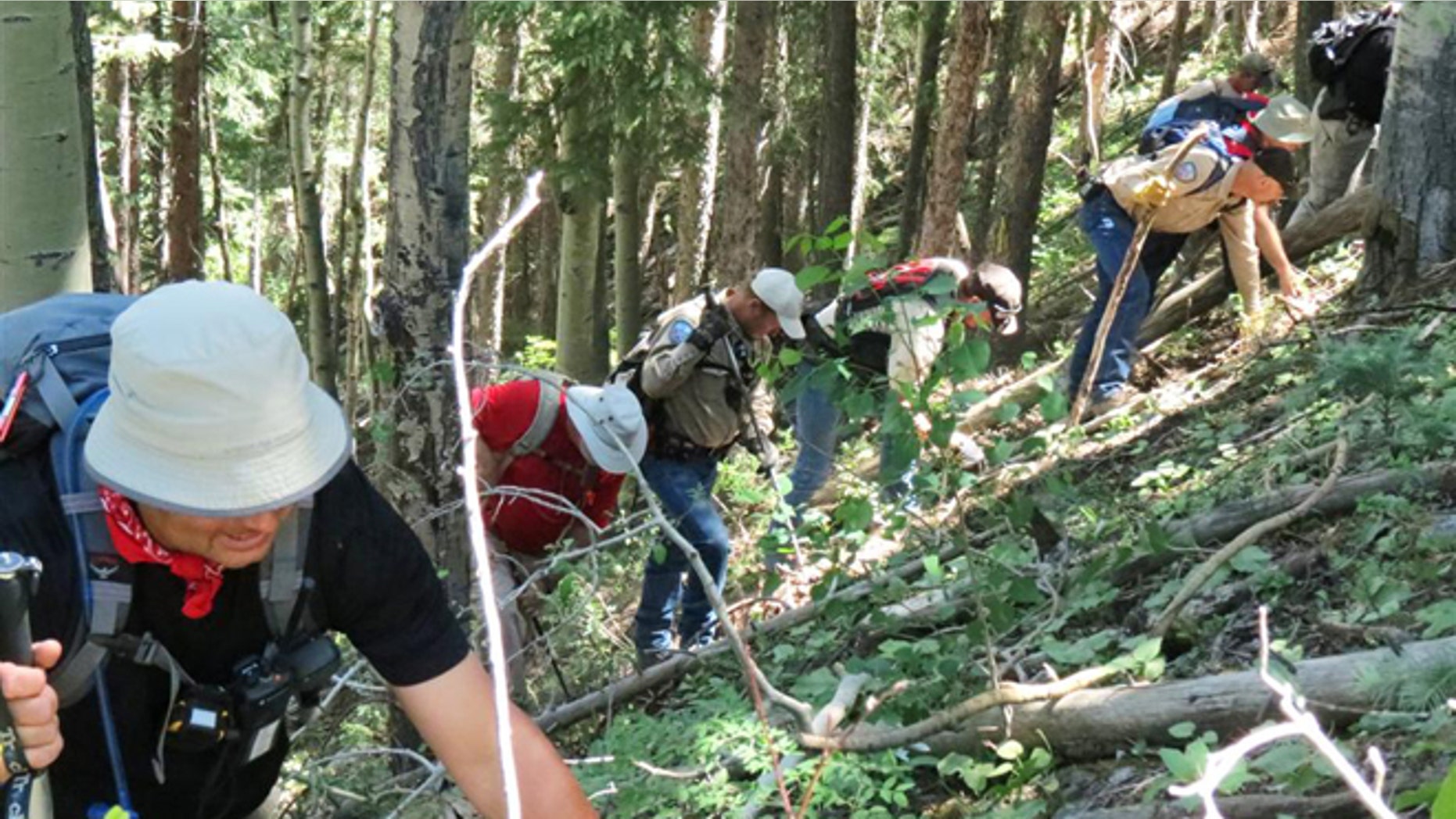 June 26, 2013: Searchers look for evidence pertaining to a missing boy, Dylan Redwine, who disappeared in southwest Colorado last November. About 45 officers spent five days searching a 12-mile stretch of Middle Mountain Road looking for clues in the case. La Plata County investigators hope some of the first clues found since a 13-year-old boy disappeared last November will help solve the mystery. Sheriff spokesman Dan Bender said in a statement that further investigation, interviews and laboratory testing will determine if any of the items are related to the disappearance of Dylan Redwine. (AP/La Plata County Sheriff's Office)