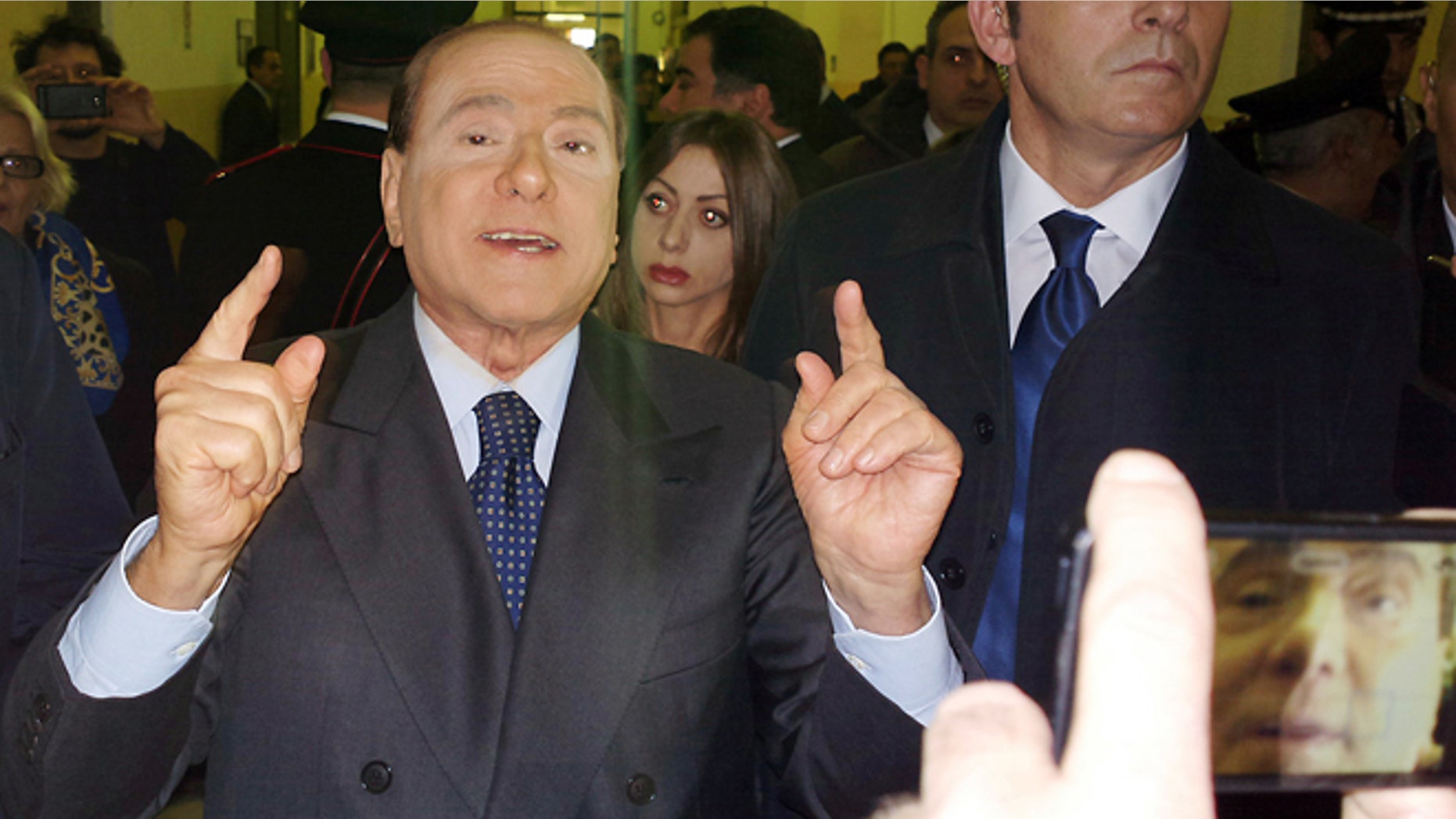 March 1, 2013: Former Italian Premier Silvio Berlusconi speaks to reporters after a hearing in his Mediaset appeals trial, at Milan's court, Italy.