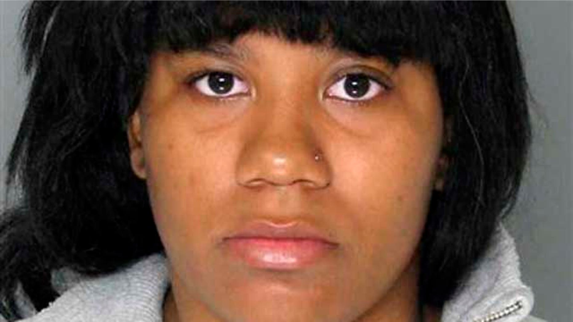 In this Monday, April 25, 2011 photo released by the Baltimore County Police, Teonna Monae Brown is shown. Brown, 18, faces assault charges in connection to an attack against a transgender woman that was caught on video took place. The video posted online shows a woman being beaten and then apparently having a seizure. Baltimore County police say a 14-year-old girl has been charged as a juvenile as well as Brown facing charges as an adult.