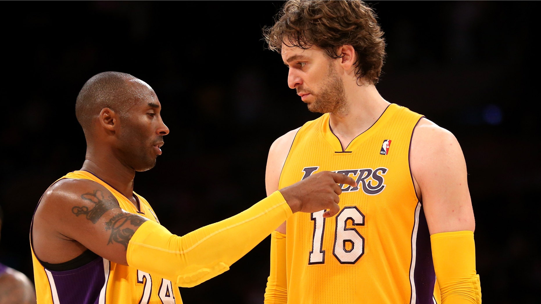 Kobe Bryant #24 and Pau Gasol #16 of the Los Angeles Lakers confer during the game with the Sacramento Kings at Staples Center on October 21, 2012 in Los Angeles, California. (Photo by Stephen Dunn/Getty Images)