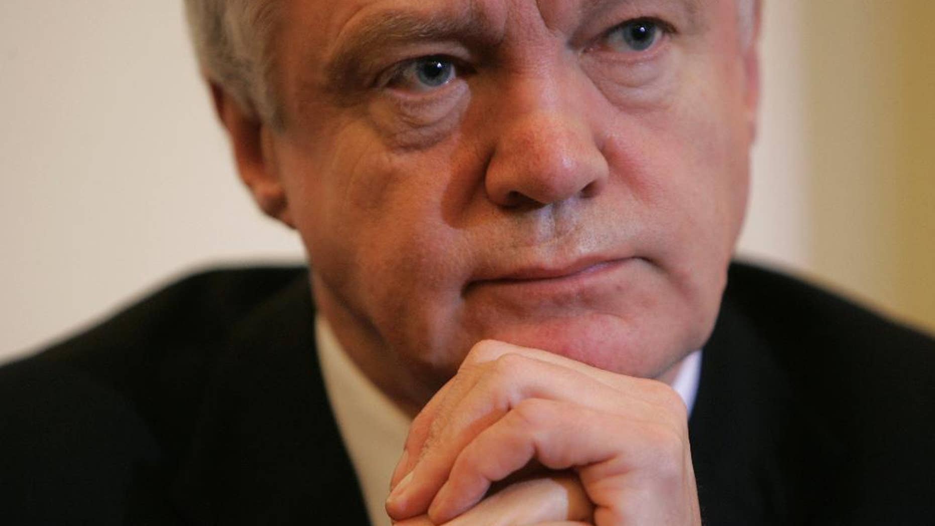 FILE - In this Wednesday, Feb. 11, 2009 file photo, the then British lawmaker David Davies attends a press conference in London. Brexit Secretary David Davis in charge of negotiating Britain’s exit from the European Union, said on Sunday July 17, 2016 that some EU citizens may not be allowed to stay after the U.K. leaves the bloc. (AP Photo/Alastair Grant, File)