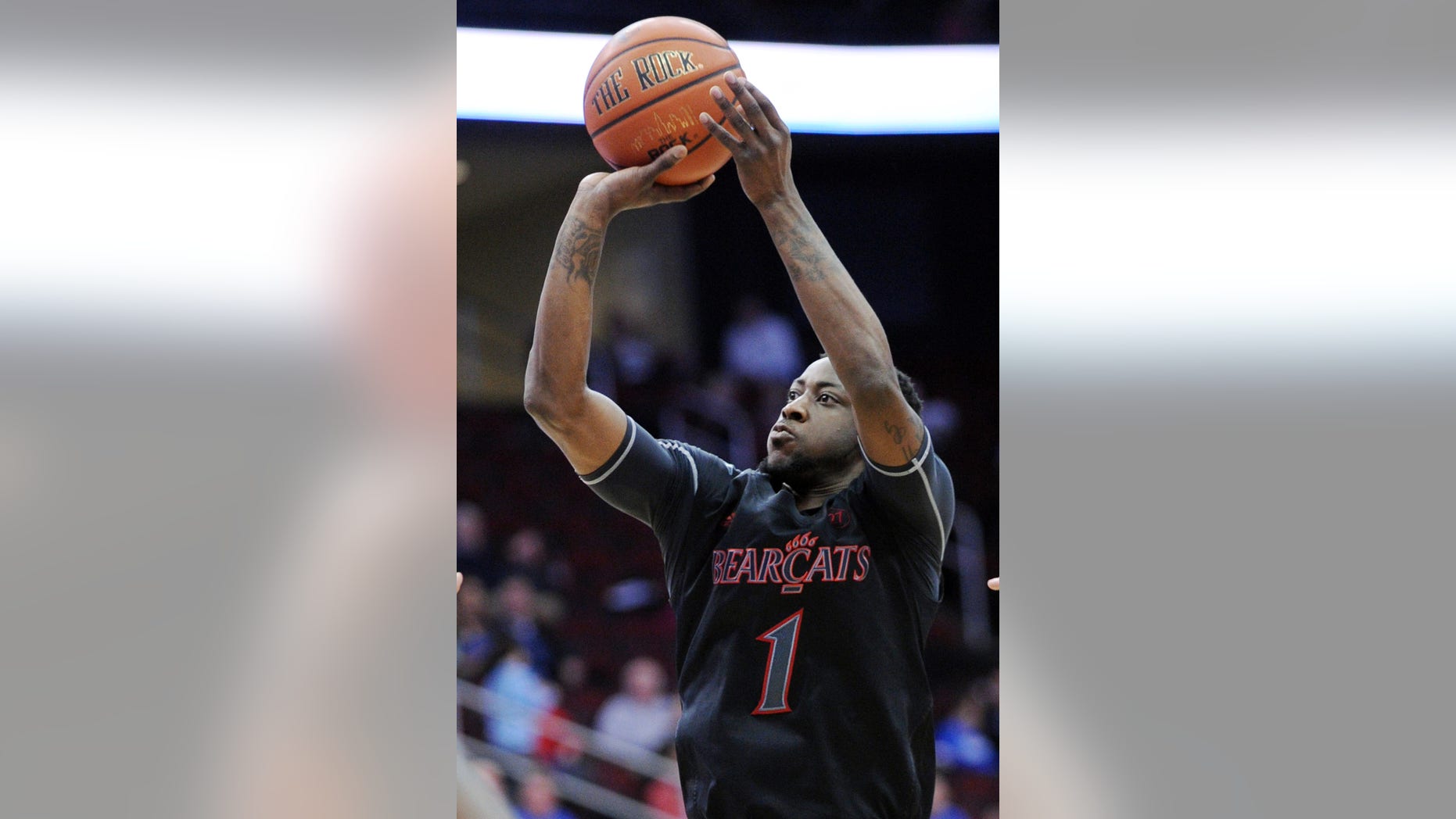 Cincinnati's Cashmere Wright shoots during the first half of an NCAA college basketball game against Seton Hall Saturday, Feb. 2, 2013, in Newark, N.J. Cincinnati defeated Seton Hall 65-59. (AP Photo/Bill Kostroun)