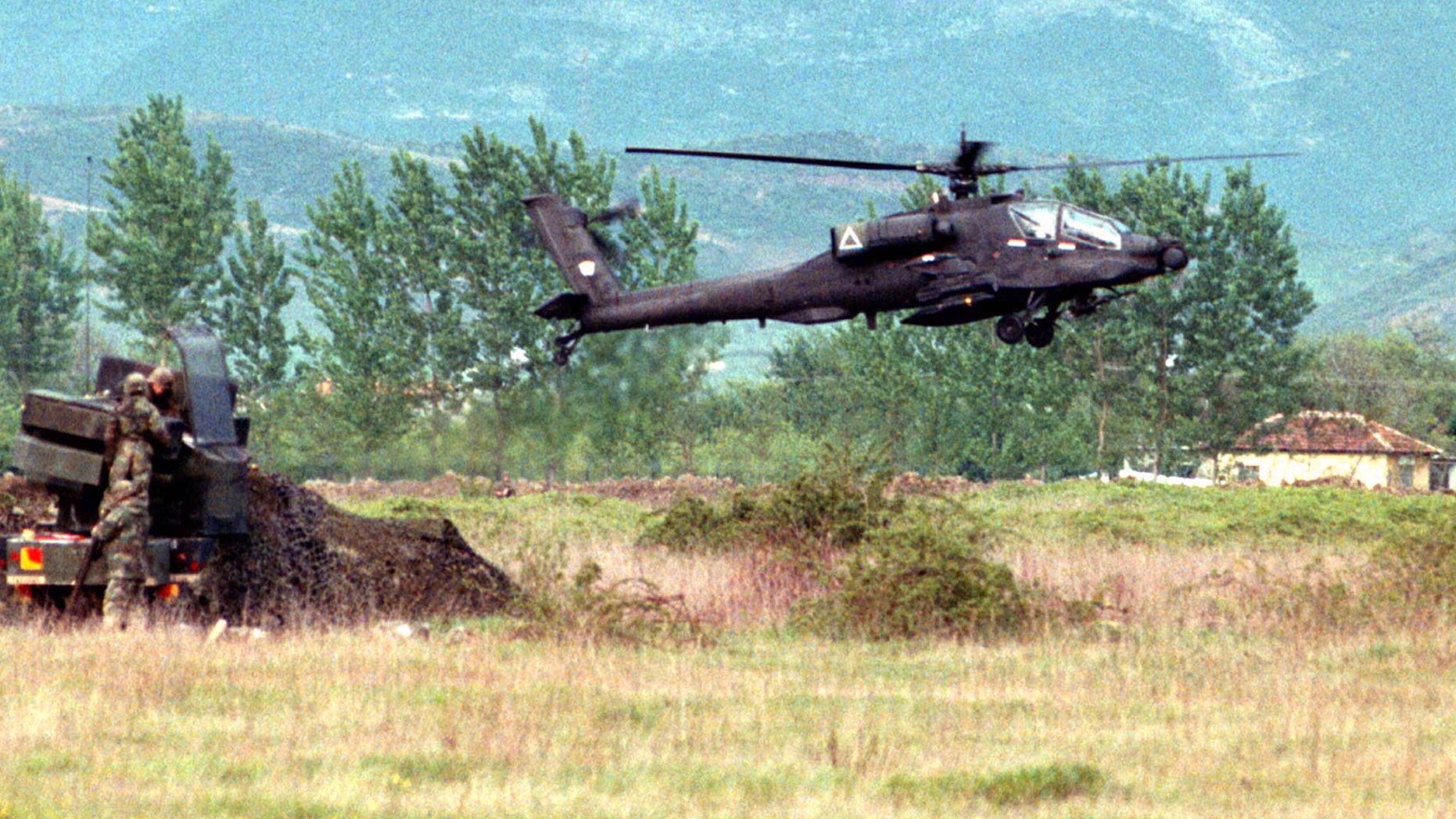 File photo: A U.S. Apache attack helicopter lands at Tirana's Rinas airport after a week of delays. MSP/JRE