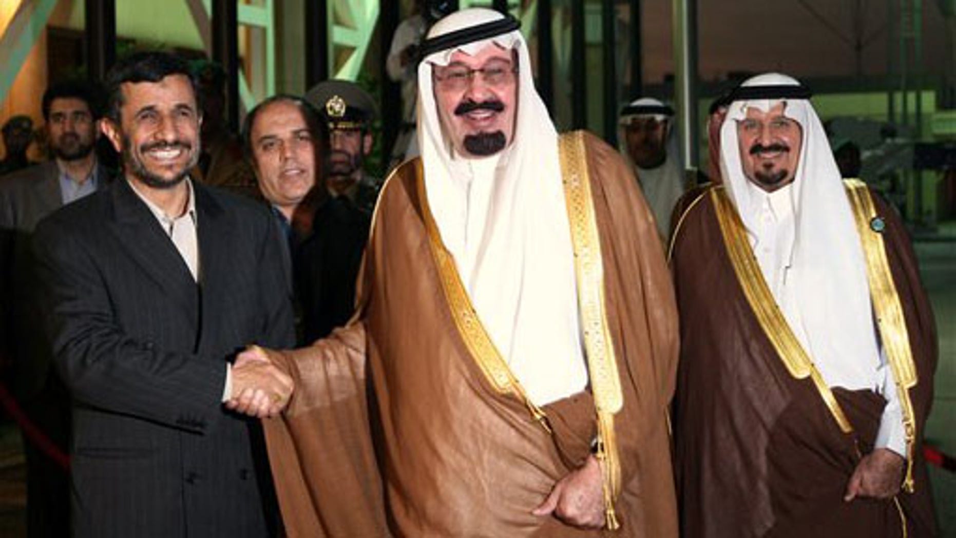 Nov. 2007: Saudi Arabia's King Abdullah, middle, shakes hands with Iran's President Mahmoud Ahmadinejad, left, as Crown Prince Sultan looks on at Riyadh airport.