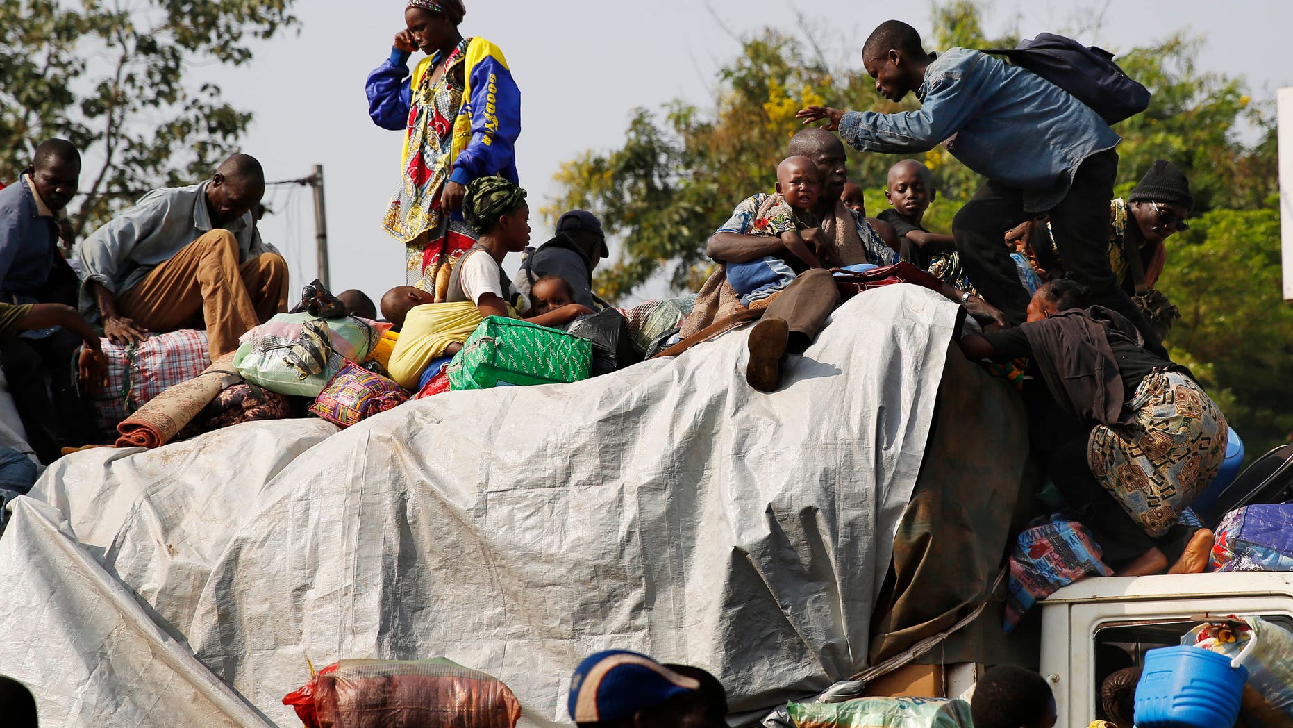 Feb. 7, 2014: At PK12, the last checkpoint at the exit of the town, thousands of Muslim residents from Bangui and Mbaiki flee the Central African Republic town of Bangui in a mass exodus using cars, pickups, trucks, lorries and motorcycles, escorted by Chadian troops.