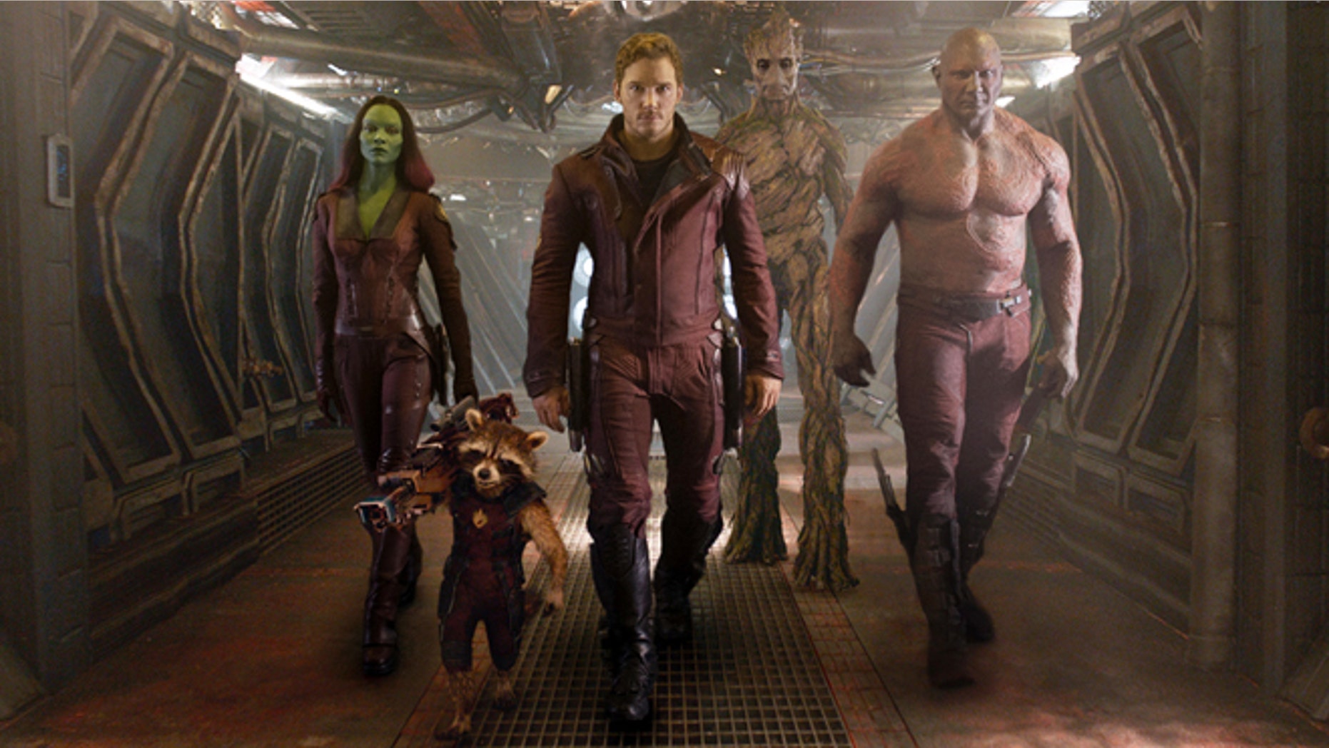 Zoe Saldana, the character Rocket Racoon, voiced by Bradley Cooper, Chris Pratt, the character Groot, voiced by Vin Diesel and Dave Bautista in a scene from "Guardians of the Galaxy."