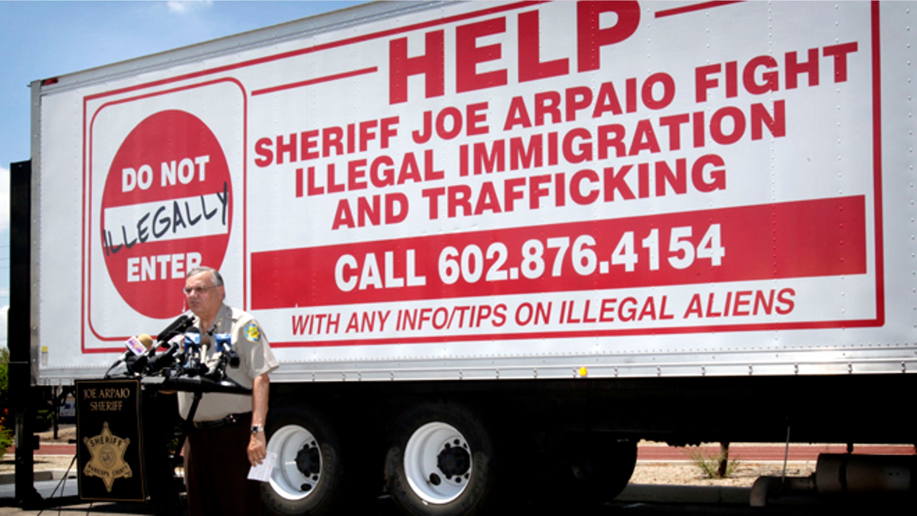 FILE - In this Thursday, July 29, 2010, file photo, Maricopa County Sheriff Joe Arpaio gives a news conference in Phoenix, announcing his crime suppression sweeps. The immigrant smuggling squad that was once a source of political strength for Arpaio is now a legal liability. Hearings will begin Tuesday, April 21, 2015, to determine if Arpaio should be held in contempt for defying a judgeâs order to stop his immigration patrols. (AP Photo/Matt York, File)