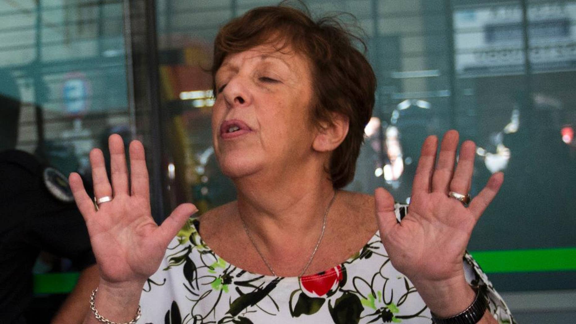 FILE - In this Jan. 22, 2015, file photo, Viviana Fein, who lead the investigation of prosecutor Alberto Nisman's death, speaks with reporters outside her office, in Buenos Aires, Argentina. Fein, who was removed from the investigation of Nisman’s mysterious death, had said before that it was likely suicide. But in an interview with local radio station La Red, she acknowledged on Thursday, May 19, 2016, for the first time that it’s possible he was “induced” to kill himself. (AP Photo/Rodrigo Abd, File)