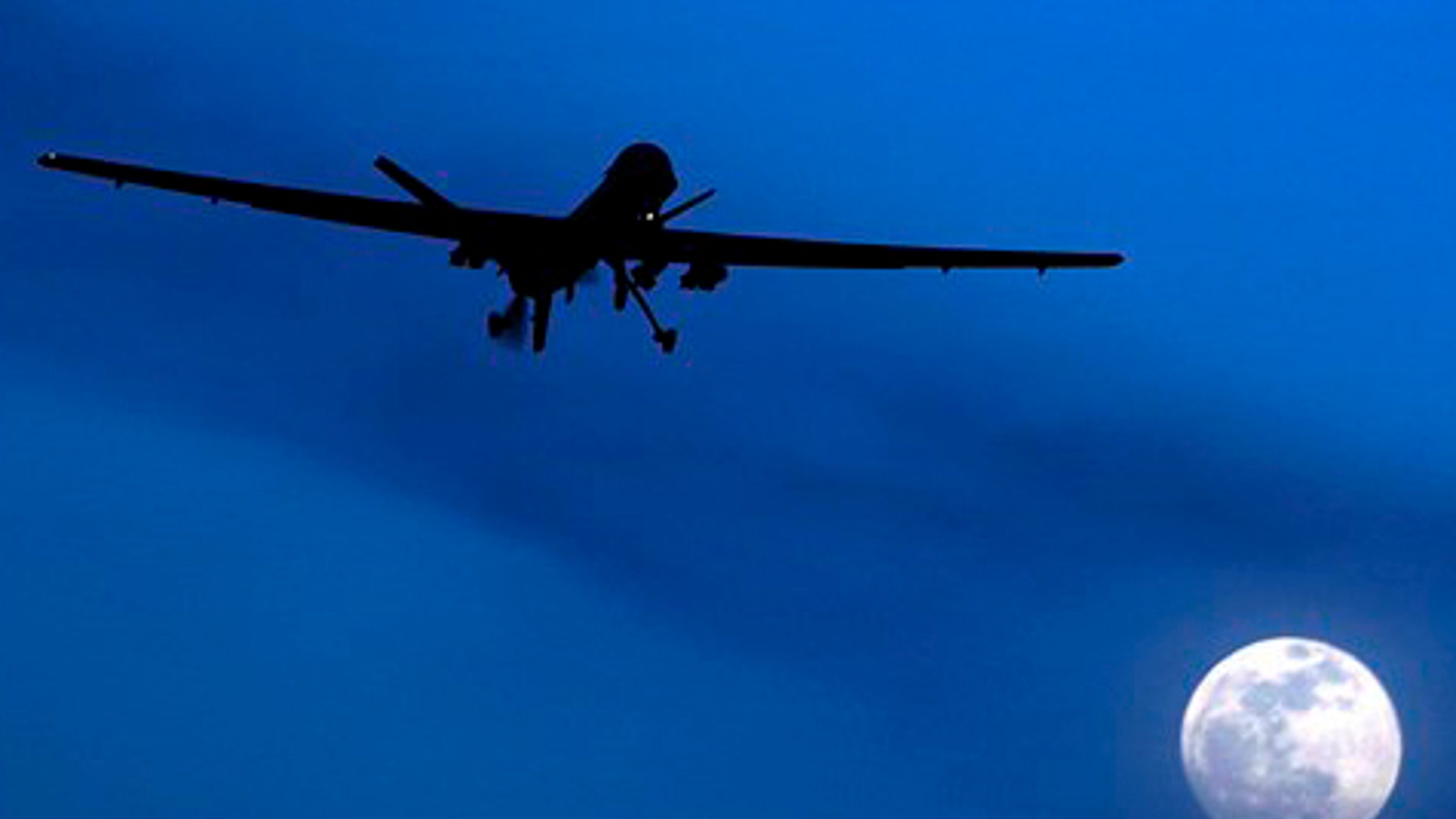 FILE: Jan. 31, 2010: An unmanned U.S. Predator drone flies over Kandahar Air Field on a moon-lit night.