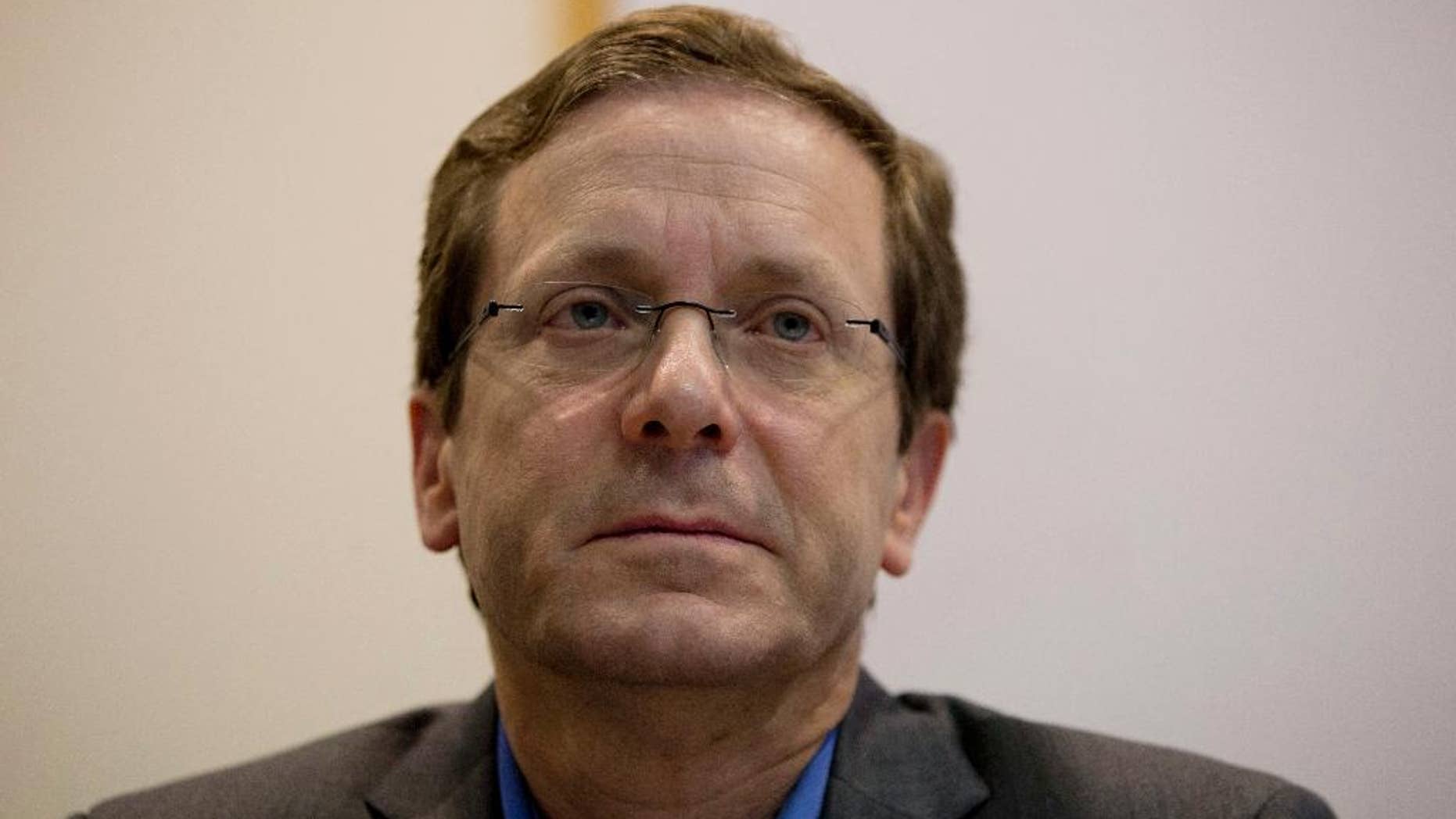 Zionist Union party co-leaders Isaac Herzog listens to Tzipi Livni as she delivers a statement in the party's election headquarters in Tel Aviv, Israel, Wednesday, March 18, 2015, a day after Israel held legislative election. Netanyahu's right-wing Likud Party scored a resounding victory in Israel's election, final results showed Wednesday, a stunning turnaround after a tight race that had put his lengthy rule in jeopardy. (AP Photo/Ariel Schalit)