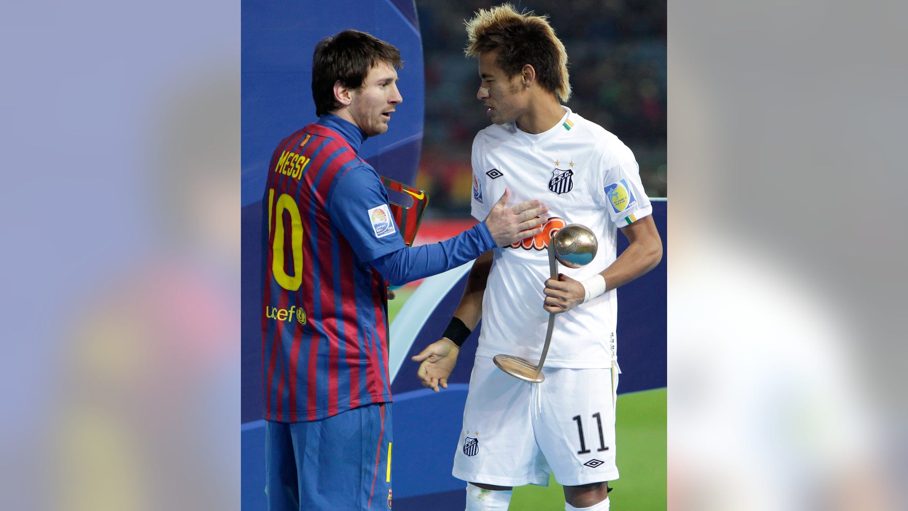 FILE.- In this Dec.18, 2011 file photo, Spain's FC Barcelona midfielder Lionel Messi, left, and Brazil's Santos FC forward Neymar congratulate at each other during an award ceremony at the Club World Cup soccer tournament in Yokohama, near Tokyo, Japan. Neymar announced Saturday May 25, 2013 he has made up his mind and will be joining Barcelona after the upcoming Confederations Cup.(AP Photo/Shizuo Kambayashi, File)