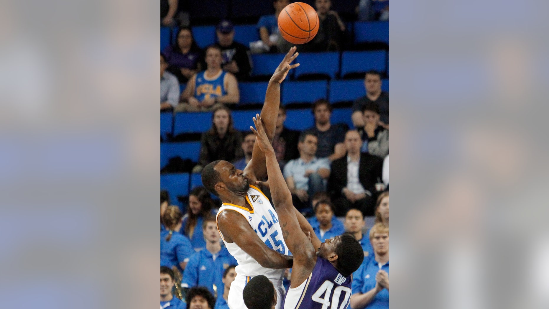 UCLA's Shabazz Muhammad (15) shoots over Washington forward Shawn Kemp Jr. (40) in the first half of an NCAA college basketball game in Los Angeles on Thursday, Feb. 7, 2013. (AP Photo/Reed Saxon)