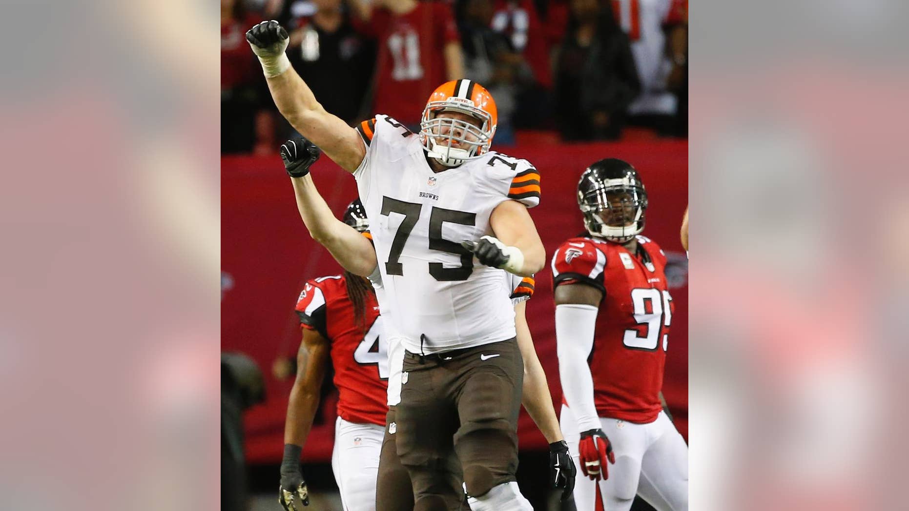 Cleveland Browns guard Joel Bitonio (75) celebrates Cleveland Browns kicker Billy Cundiff's game-winning field goal against the Atlanta Falcons after the second half of an NFL football game, Sunday, Nov. 23, 2014, in Atlanta. The Cleveland Browns won 26-24. (AP Photo/John Bazemore)