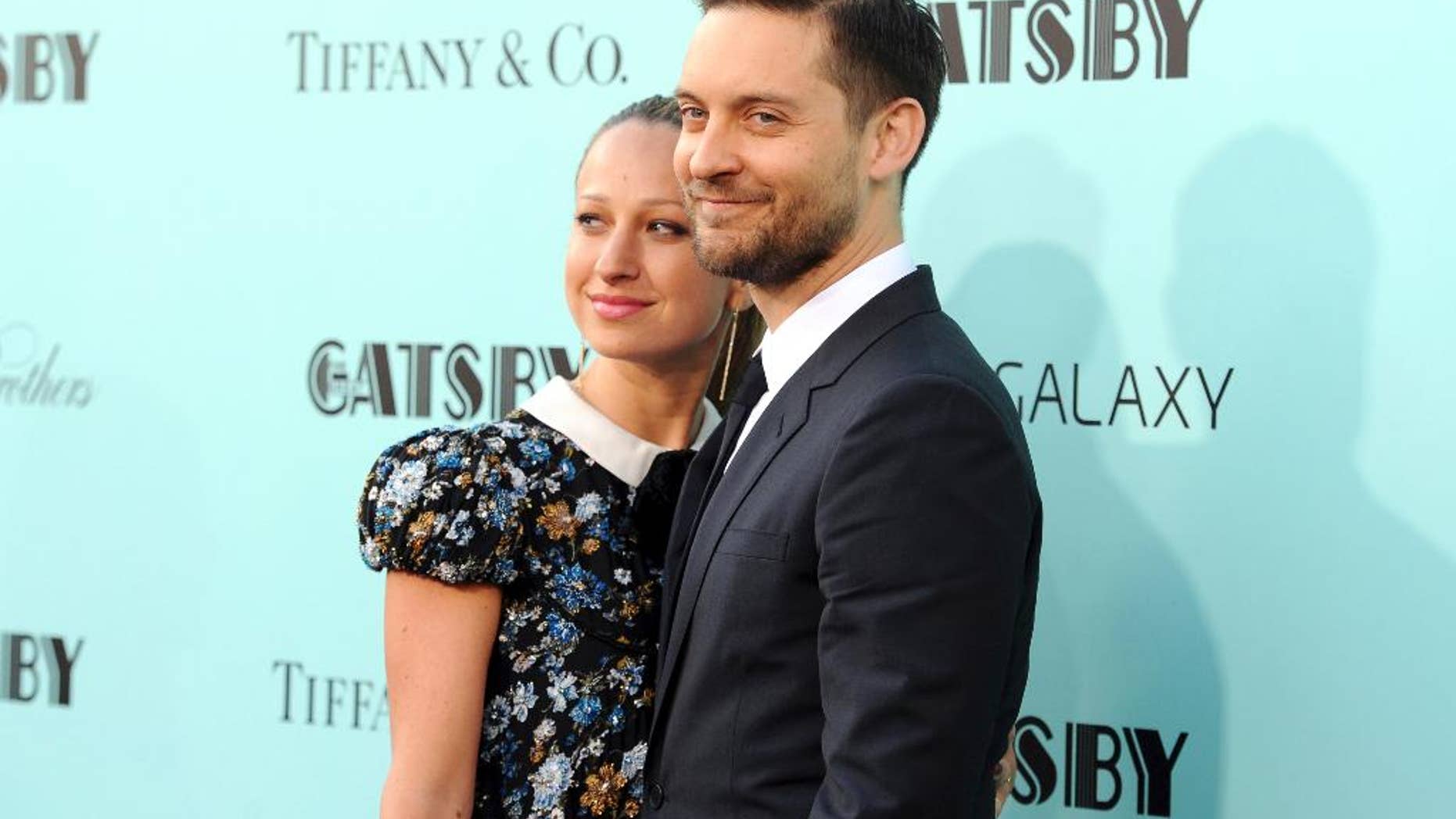 FILE - In this May 1, 2013, file photo, actor Tobey Maguire, right, and wife Jennifer Meyer attend "The Great Gatsby" world premiere in New York. A representative for Maguire confirmed a People magazine report on Oct. 18, 2016, that Maguire and Meyer have separated after nine years of marriage. (Photo by Evan Agostini/Invision/AP, File)