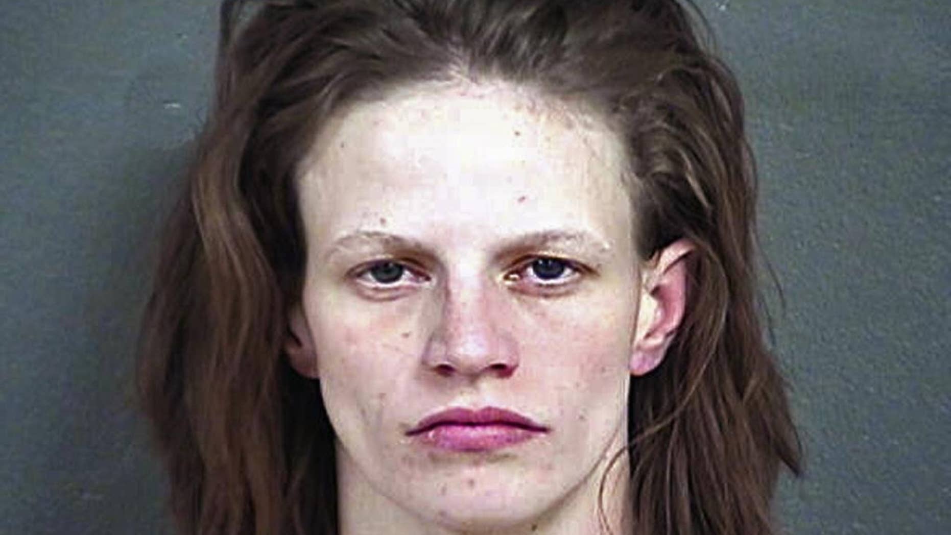 FILE - This undated file photo provided by the Wyandotte County Detention Center in Kansas shows Heather Jones, who was sentenced Monday, Nov. 14, 2016, to life in prison for her role in the death of her 7-year-old stepson, who authorities say had been brutally abused and whose remains were found in the family's home in Kansas City, Kan. (Wyandotte County Detention Center via AP, File)