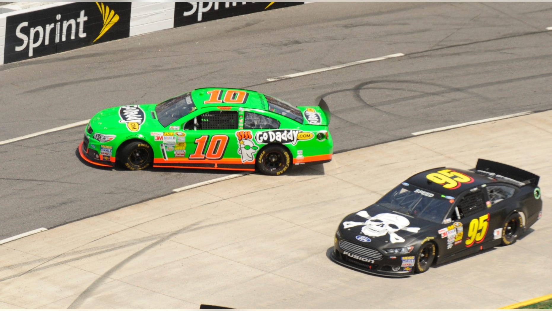 Danica Patrick (10) spins out in front of Scott Speed (95) during the STP 500 NASCAR Sprint Cup series auto race at Martinsville Speedway in Martinsville, Va., Sunday, April 7, 2013. (AP Photo/Don Petersen)