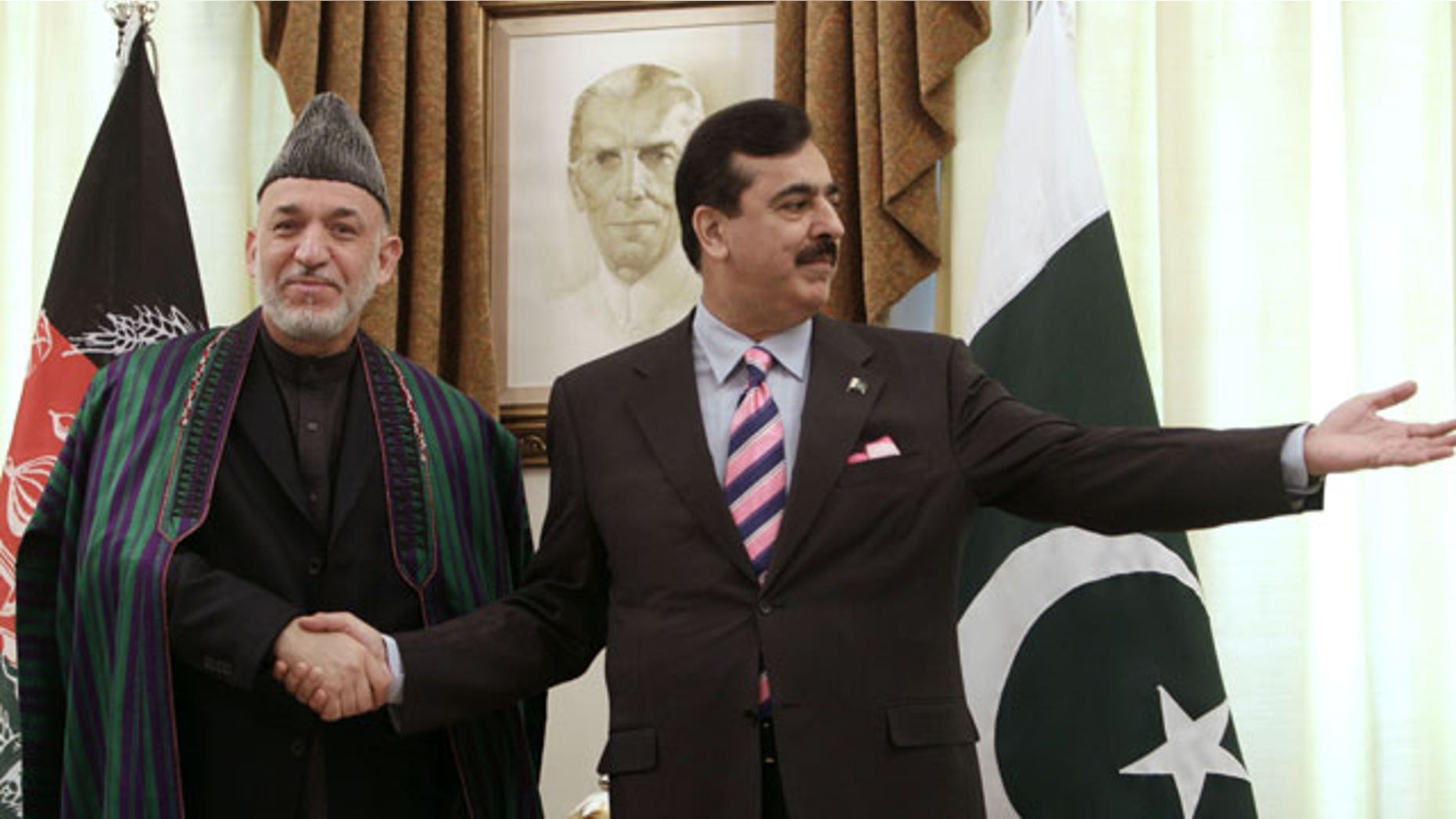 Feb. 16, 2012: Pakistan's Prime Minister Yousaf Raza Gilani, right, invites visiting Afghan President Hamid Karzai for talks upon his arrival at Prime Minister House in Islamabad, Pakistan.