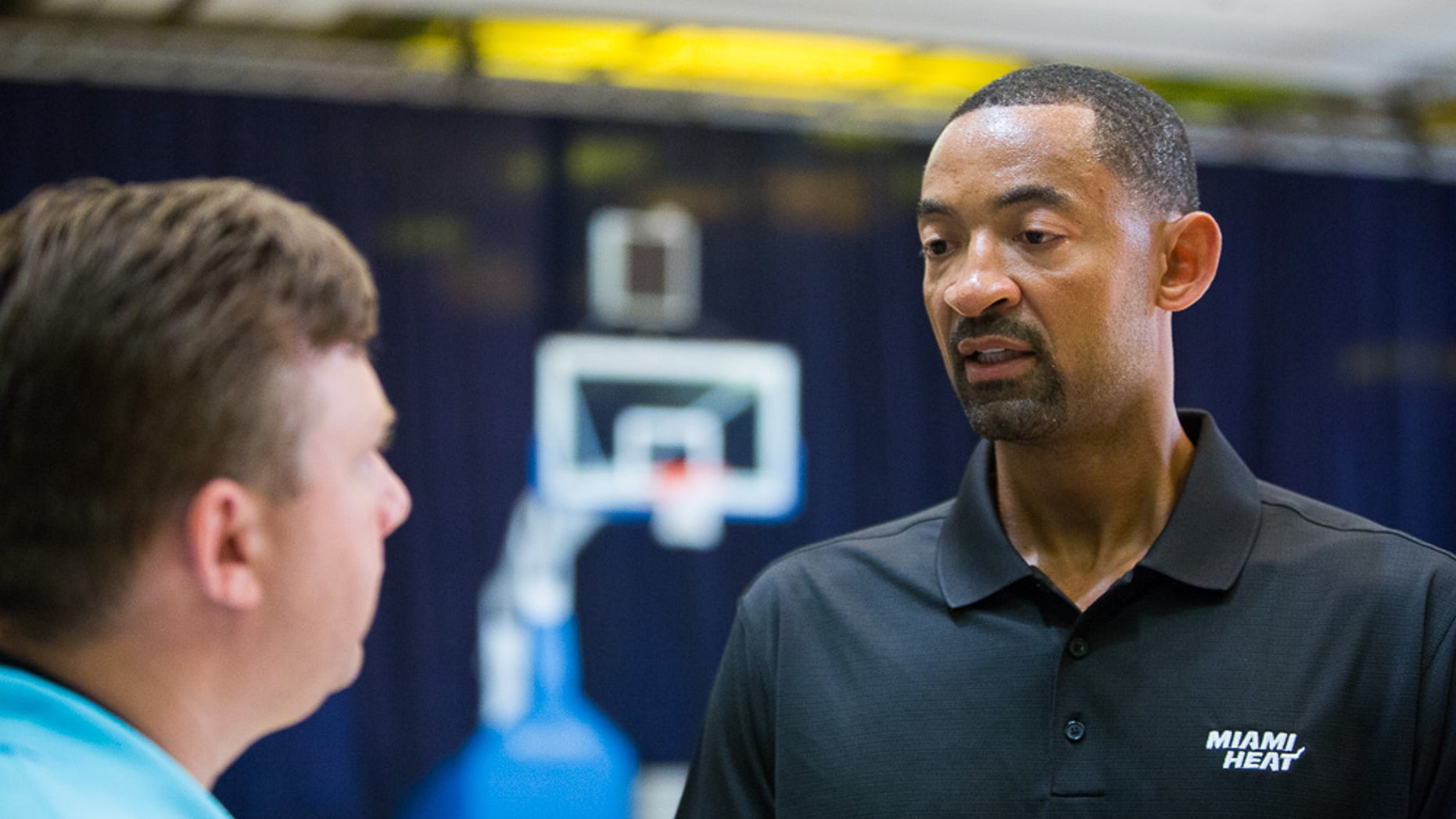 Juwan Howard talks with Tim Reynolds about transitioning from life as a player to life as an assistant coach Wednesday Oct. 2, 2013 at the Atlantis Resort in Paradise Island, Bahamas after practice. Howard is starting his first season as a Heat assistant coach, turning down other job opportunities to stay in Miami and start a path that he hopes eventually leads to him taking over his own team. He spent the last three years of his playing career with Miami, winning his first two championship rings. (AP Photo/Bahamas Visual Services, Dante Carrer)